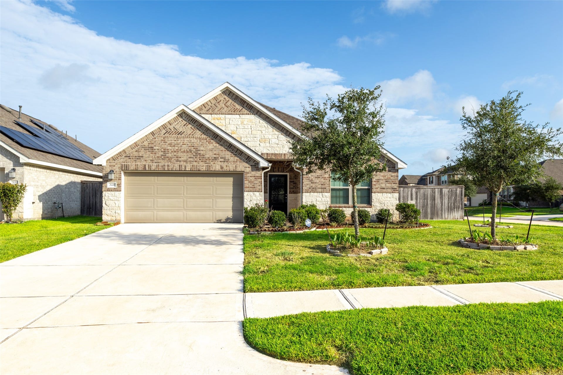 2610 Blue Abbot Drive, Fresno, TX 77545 Charming single-story home with a brick and stone facade.