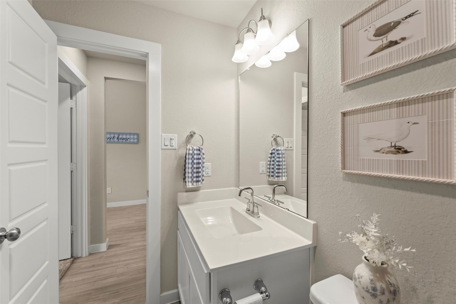 2610 Blue Abbot Drive, Fresno, TX 77545 Charming bathroom with a sleek white vanity, modern fixtures, and tasteful decor that creates a serene atmosphere.