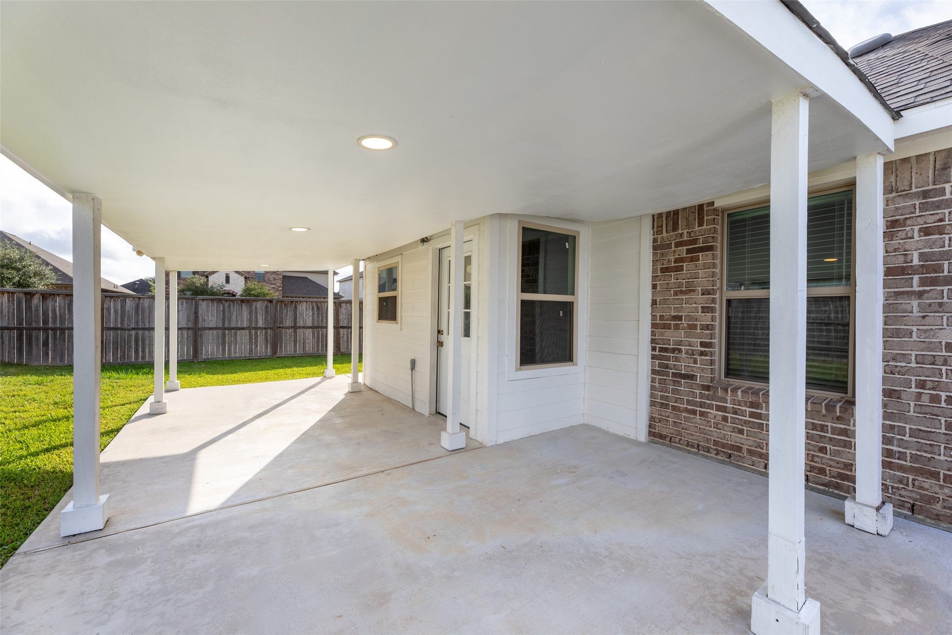 2610 Blue Abbot Drive, Fresno, TX 77545 Sturdy roof, perfect for outdoor gatherings, overlooks a well-maintained fenced backyard.