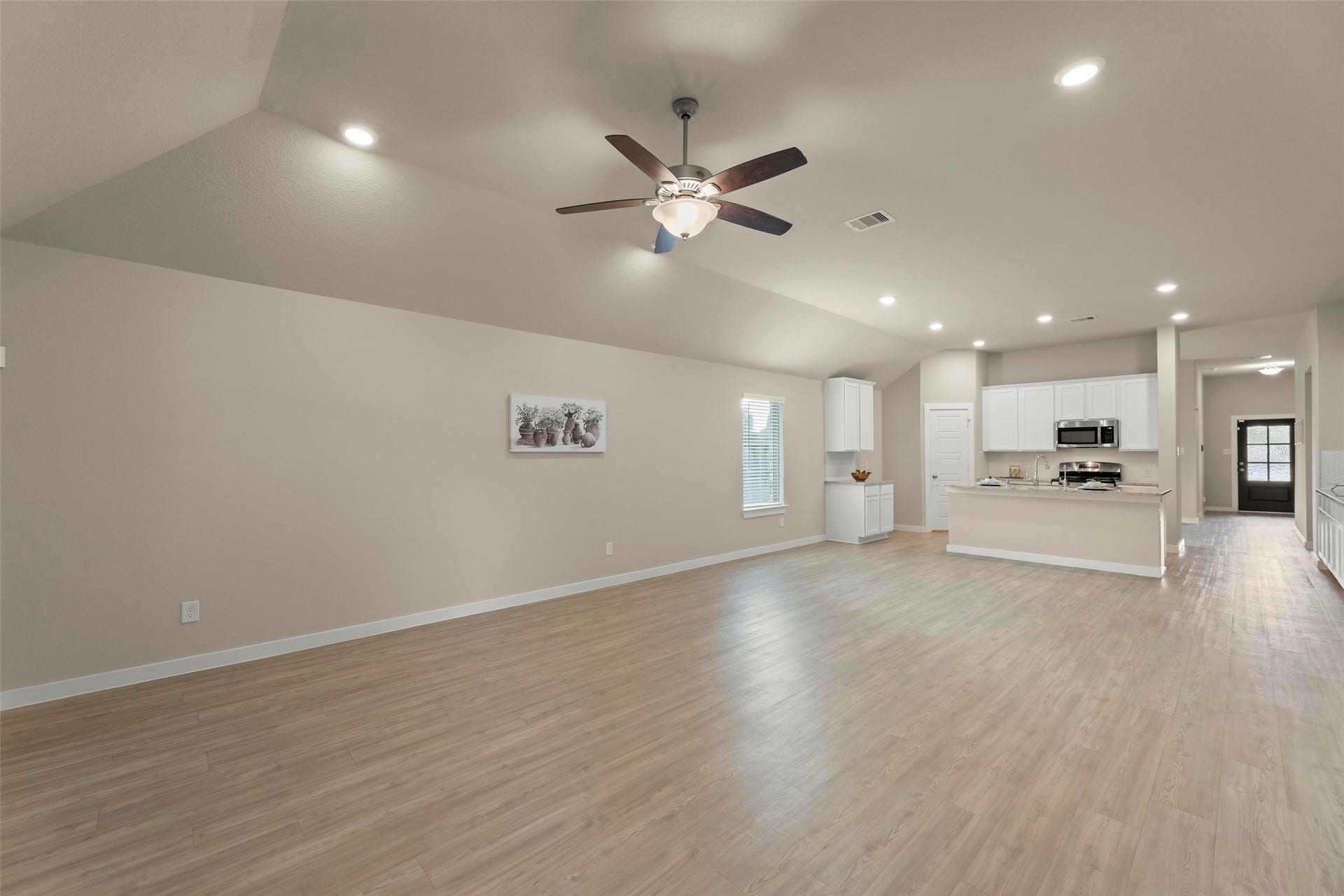 2610 Blue Abbot Drive, Fresno, TX 77545 Elegant hardwood floors, recessed lighting, and a modern kitchen.