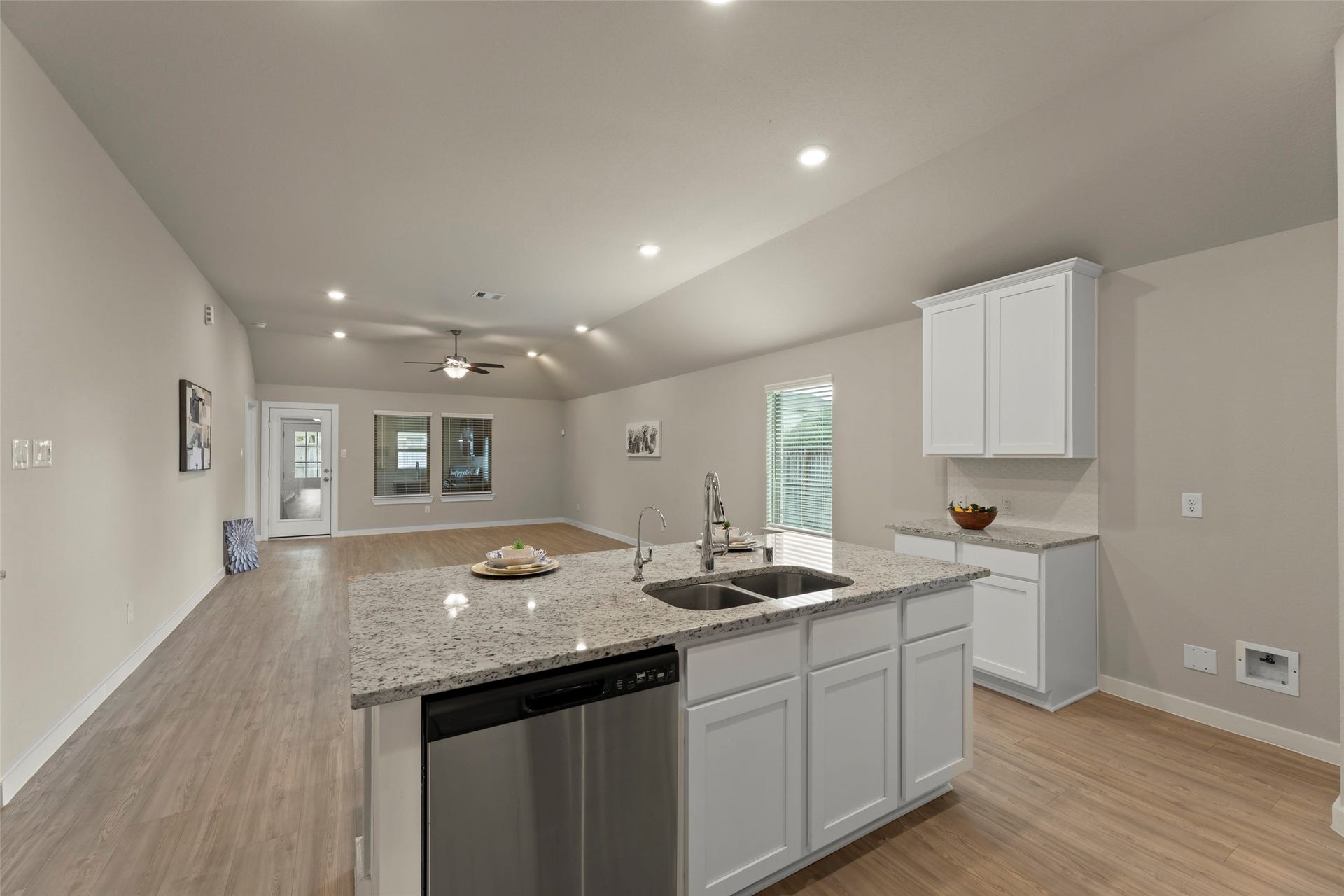 2610 Blue Abbot Drive, Fresno, TX 77545 Large granite island, modern fixtures, and abundant natural light.