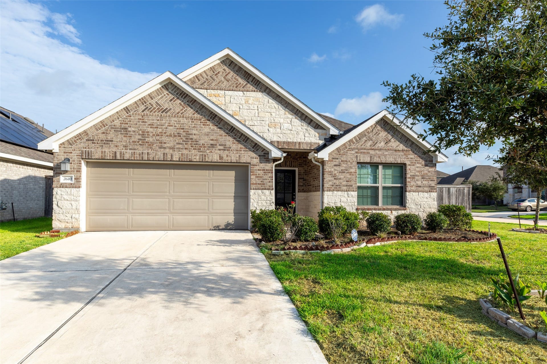 2610 Blue Abbot Drive, Fresno, TX 77545 Spacious two-car garage, and a beautifully landscaped front yard.