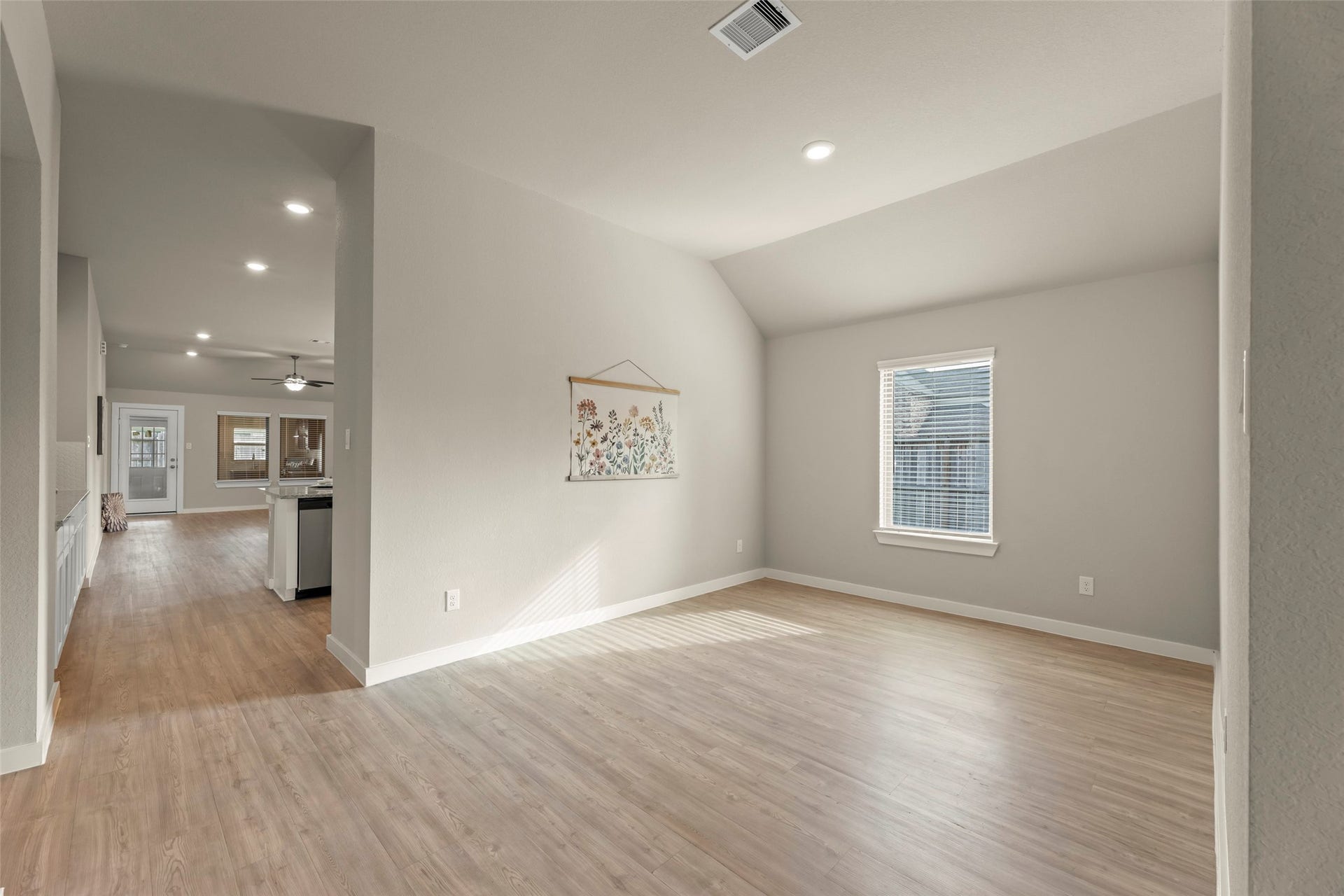 2610 Blue Abbot Drive, Fresno, TX 77545 Abundant natural light, and modern finishes, seamlessly connecting to the kitchen and dining space.