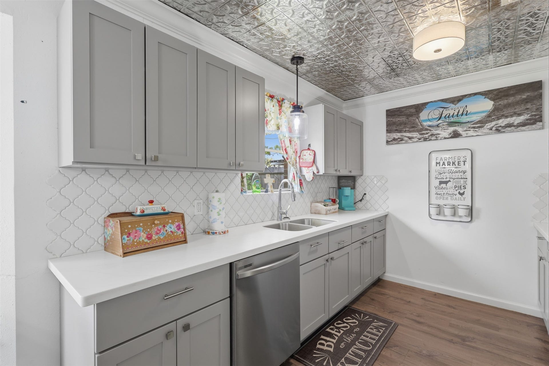 Another view of the kitchen showcasing its efficient layout and plentiful storage.