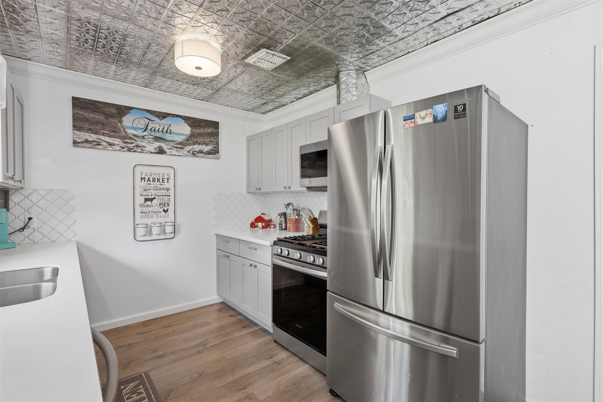 Functional kitchen features ample cabinetry, generous counter space, and stainless steel appliances.