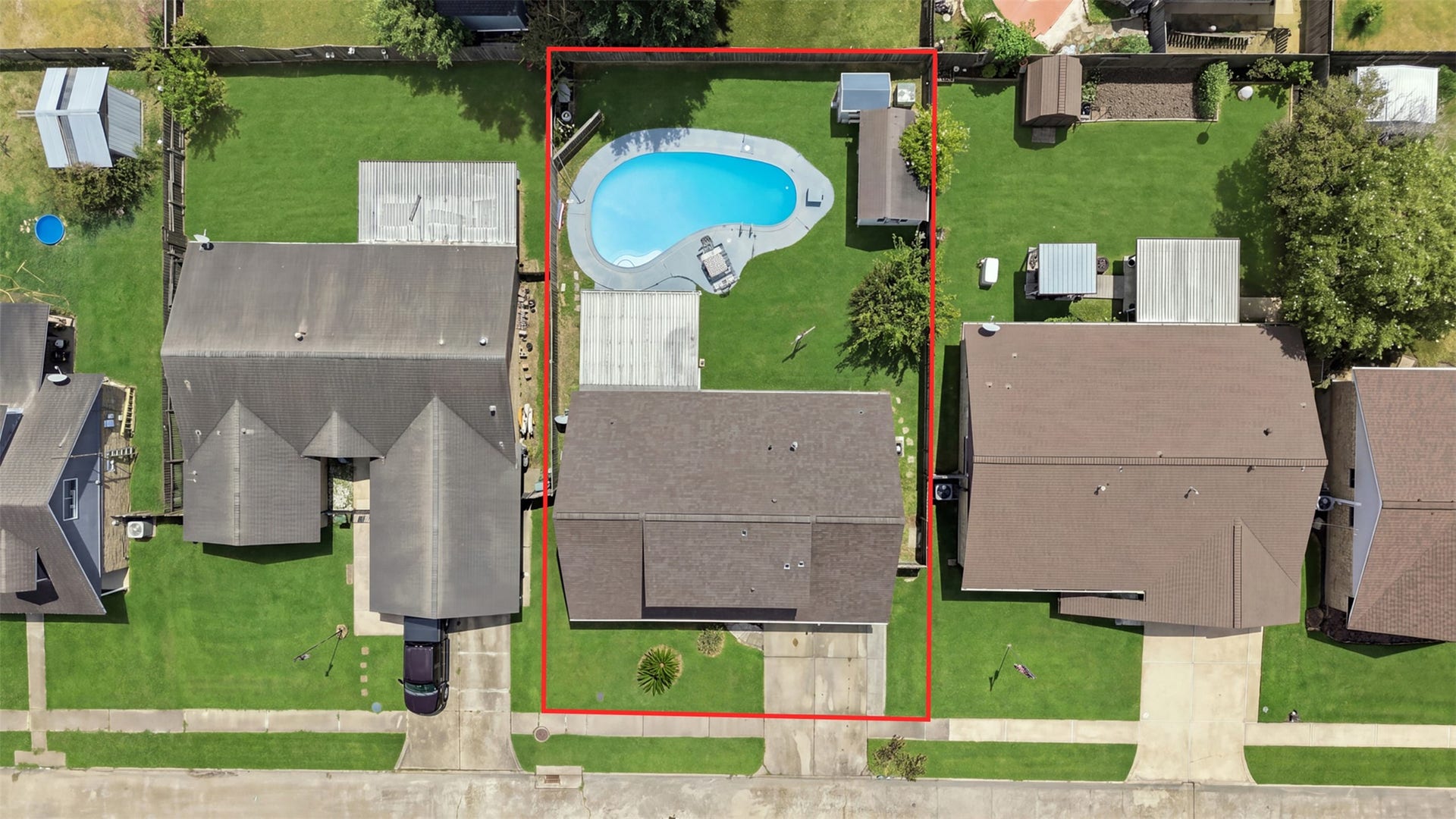 Overhead perspective offering a closer look at the property and spacious backyard.