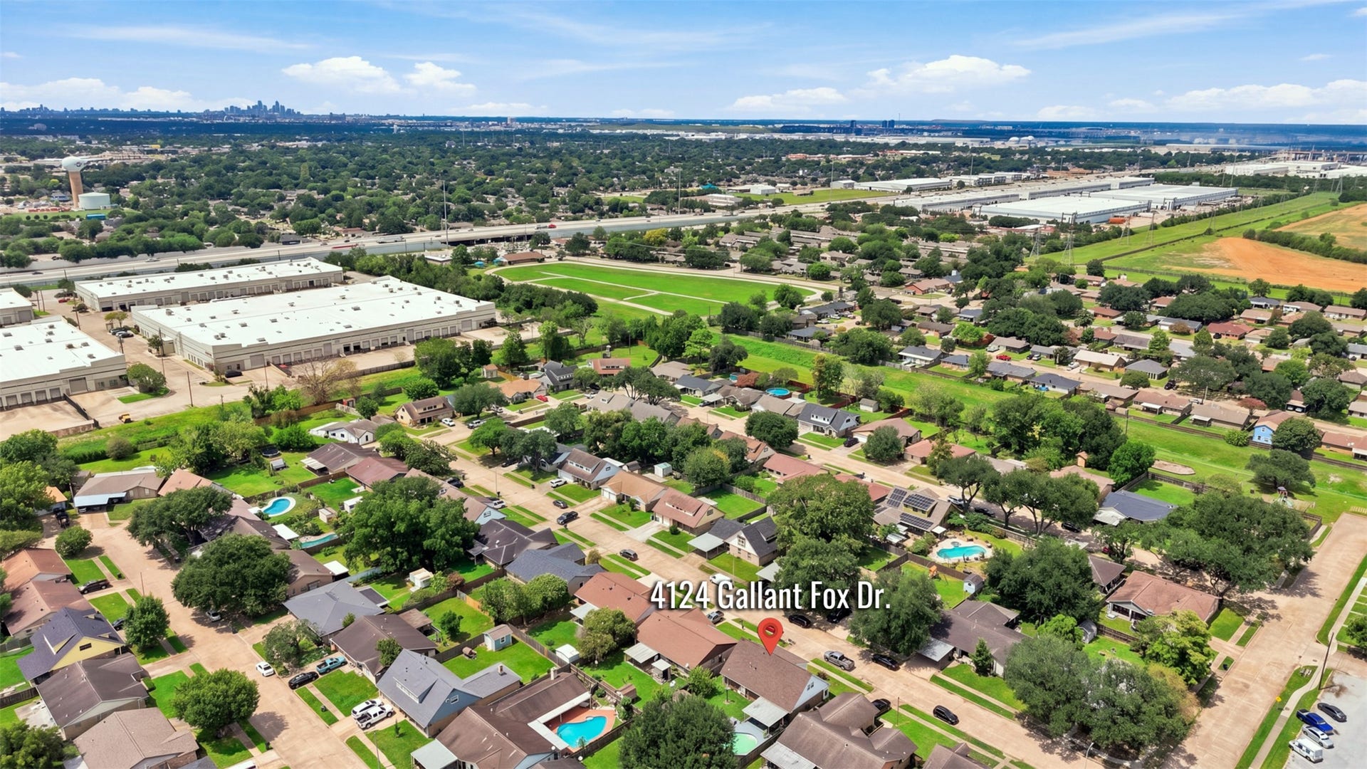 Wide aerial perspective showcases the homes location within the established Pasadena neighborhood.