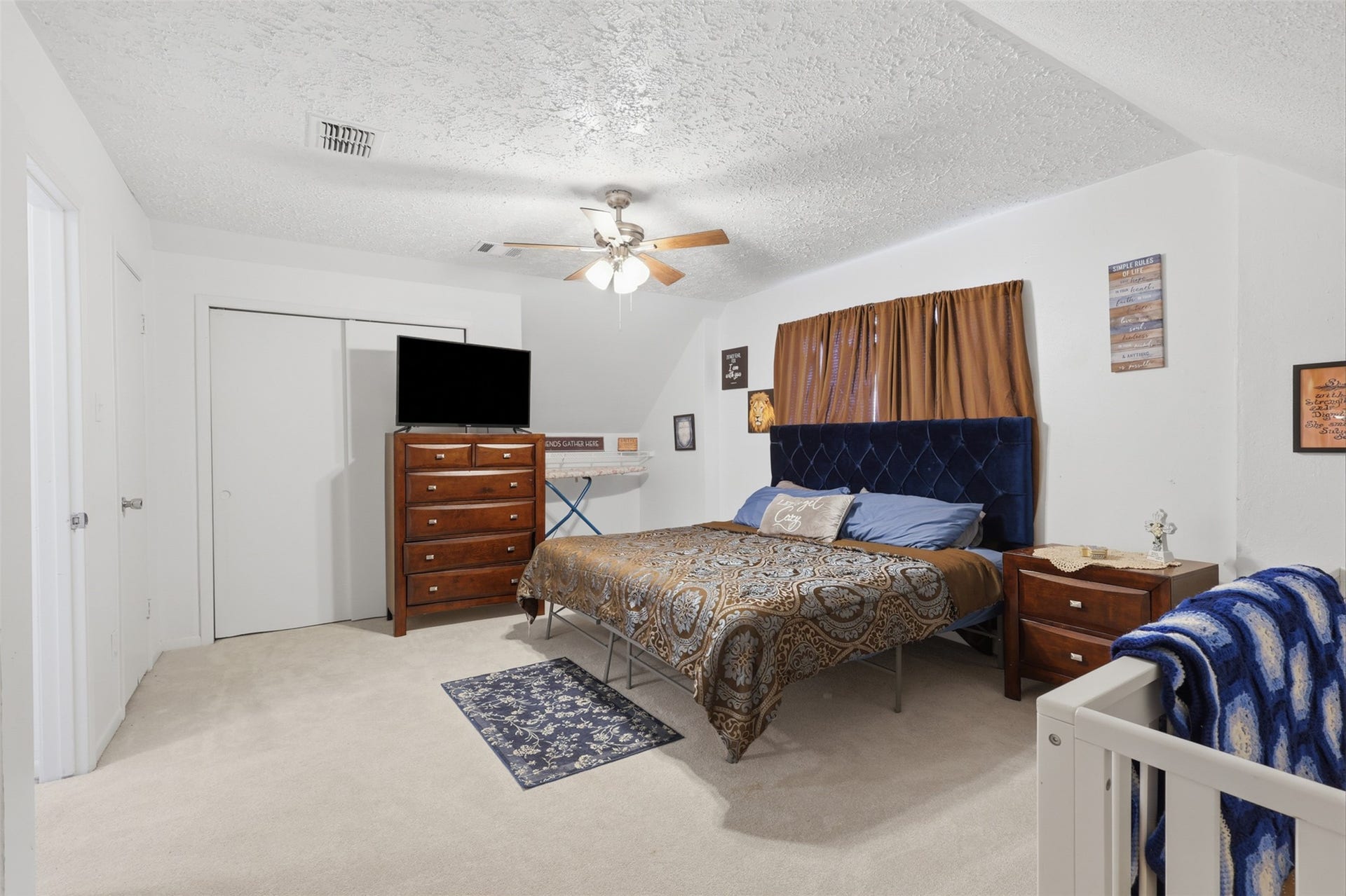 First-floor primary bedroom offers a comfortable retreat with convenient access to the main living areas.