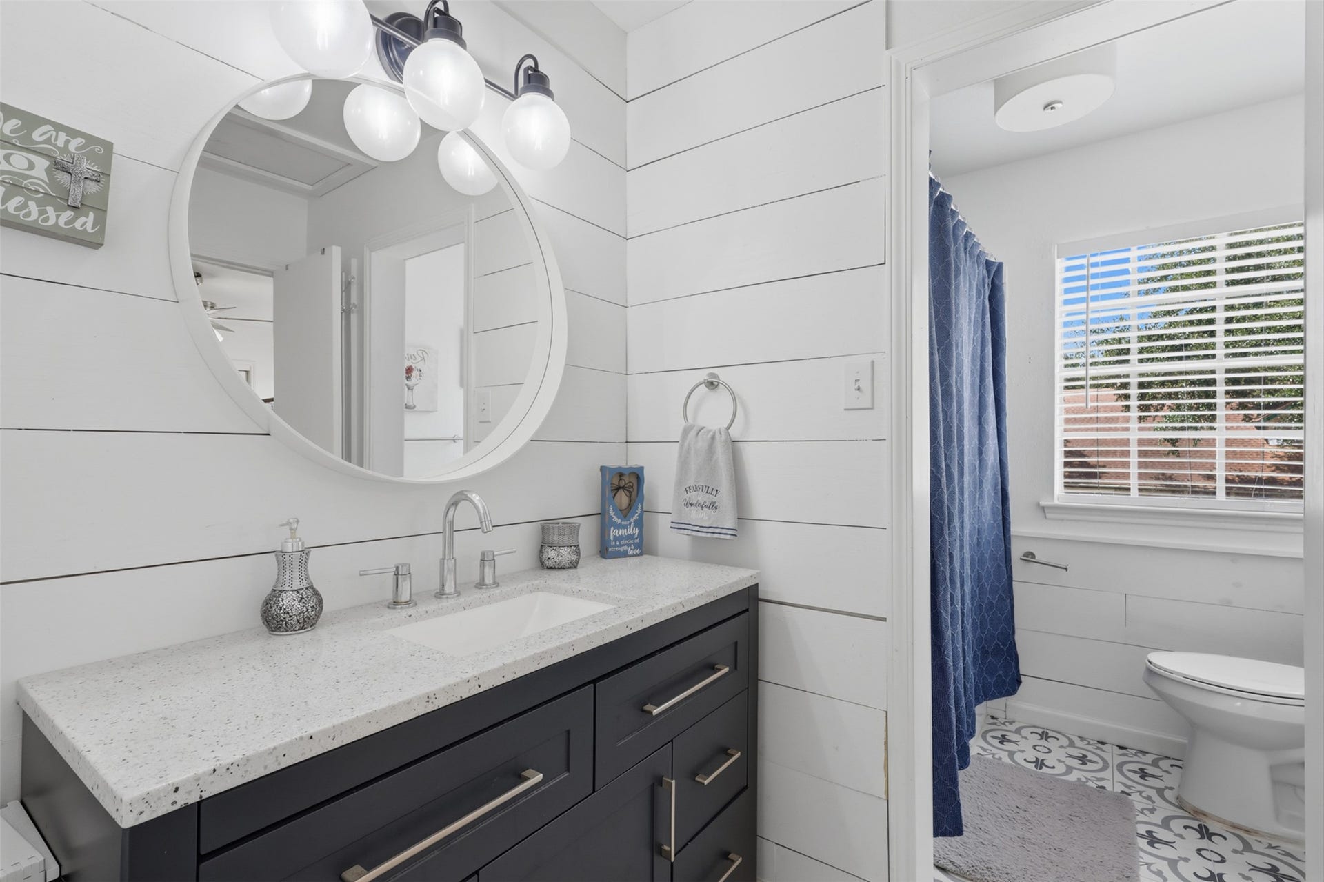 Full bathroom features a tub/shower combination and updated vanity.
