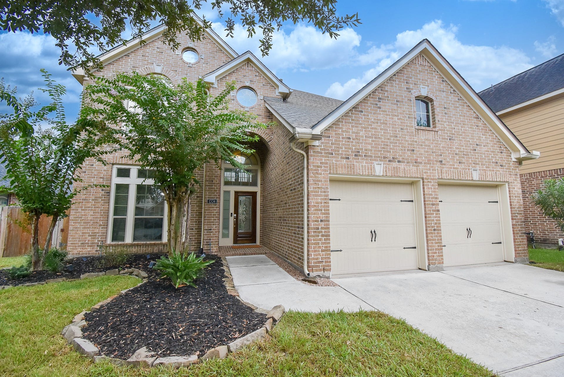 1334 Laura Hills Lane, Spring, TX 77386 Custom landscape beds with a sprinkler system making it easy to maintain.