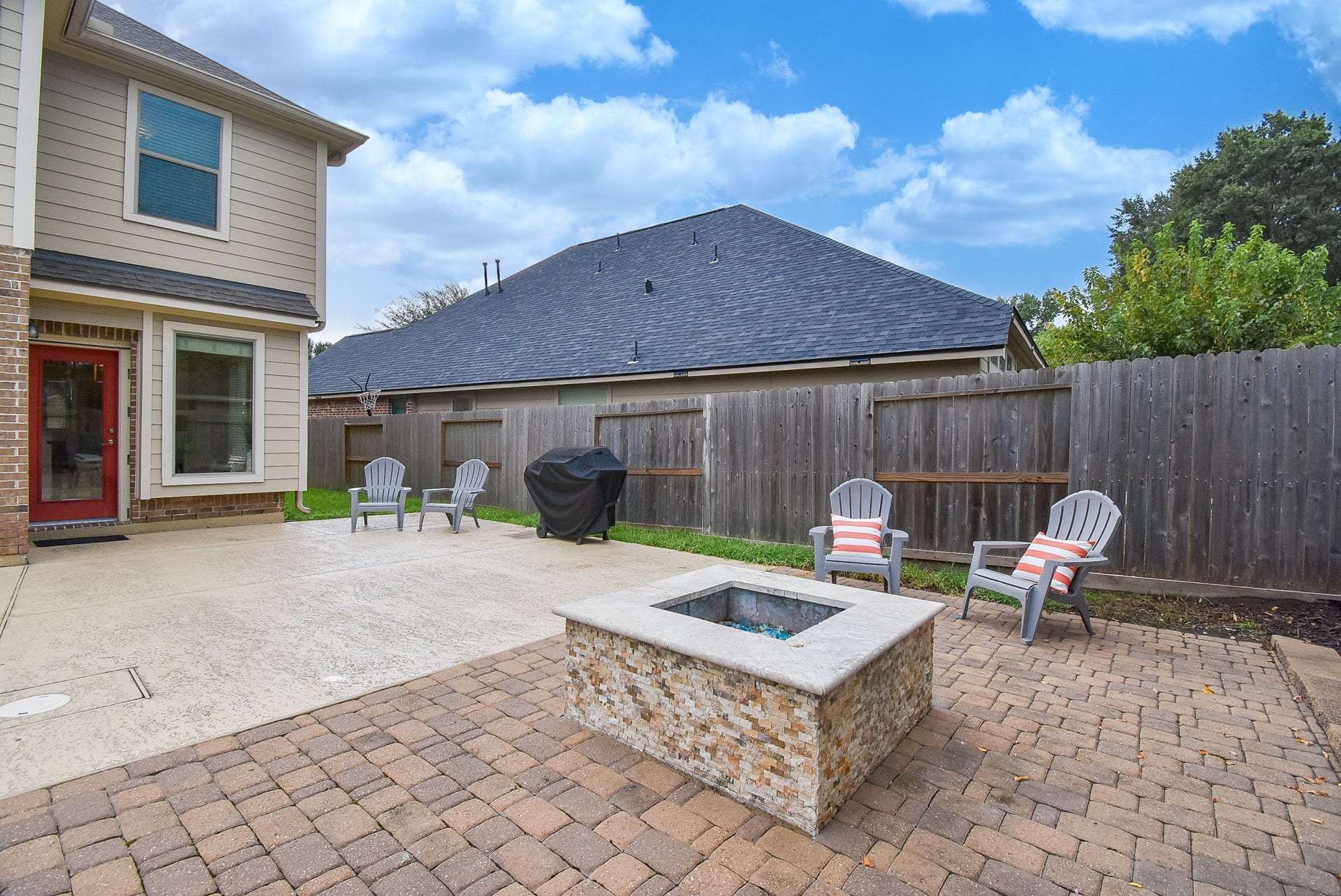 1334 Laura Hills Lane, Spring, TX 77386 The firepit is surrounded by custom Pavers!
