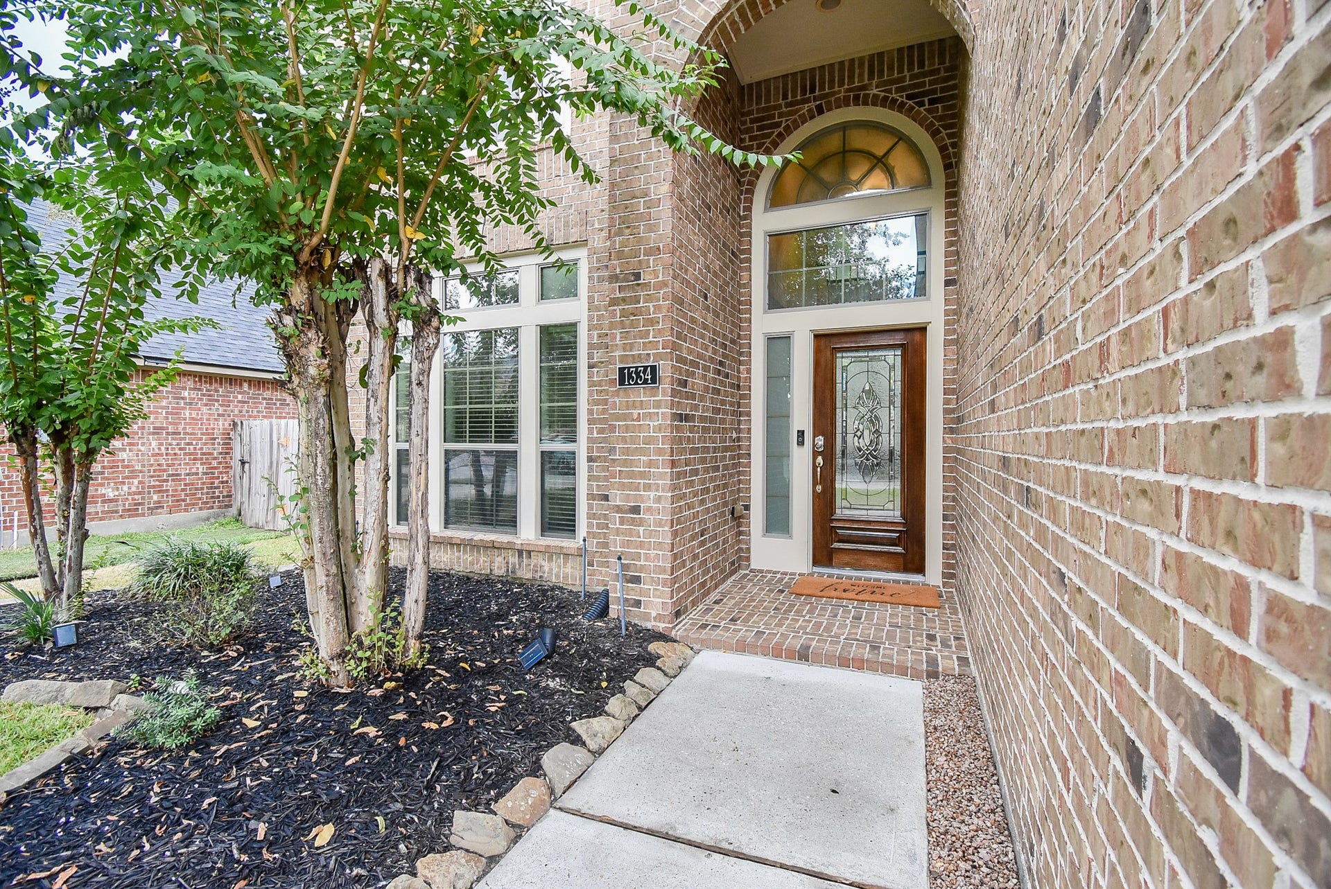 1334 Laura Hills Lane, Spring, TX 77386 Impressive entry features solid wood door with glass insert.