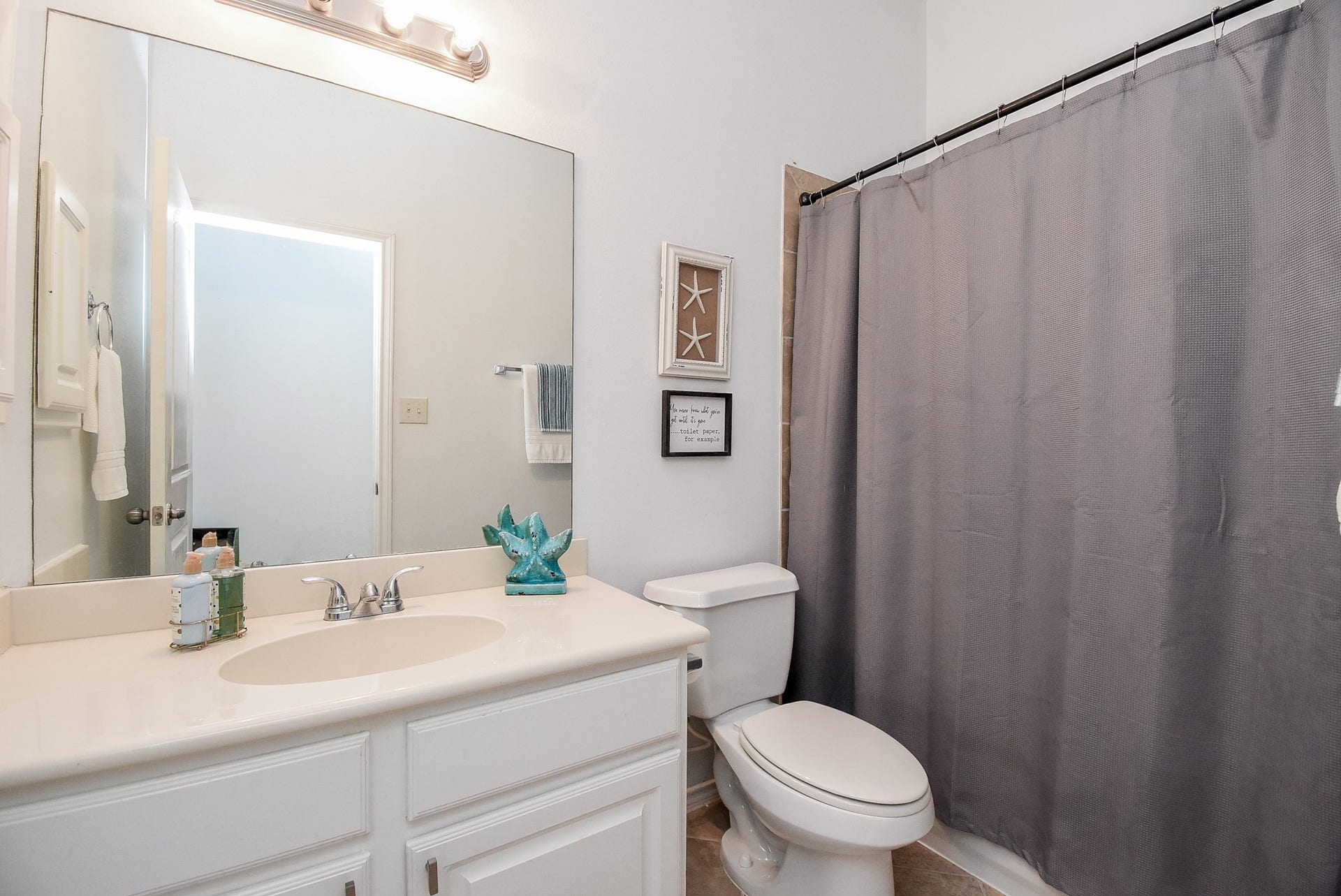 1334 Laura Hills Lane, Spring, TX 77386 The second full bath has cabinet storage and tile shower surround!