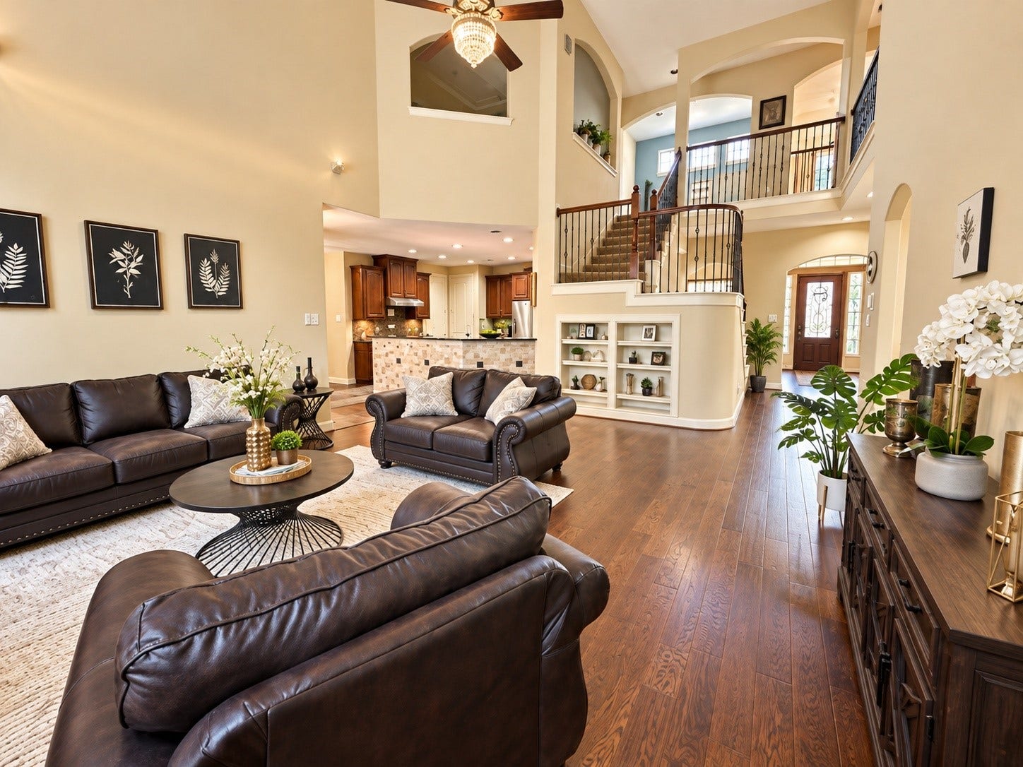 14215 Windy Crossing Lane, Humble, TX 77396 Beautifully designed living area featuring elegant archways, rich wood flooring, and an airy, welcoming atmosphere.
