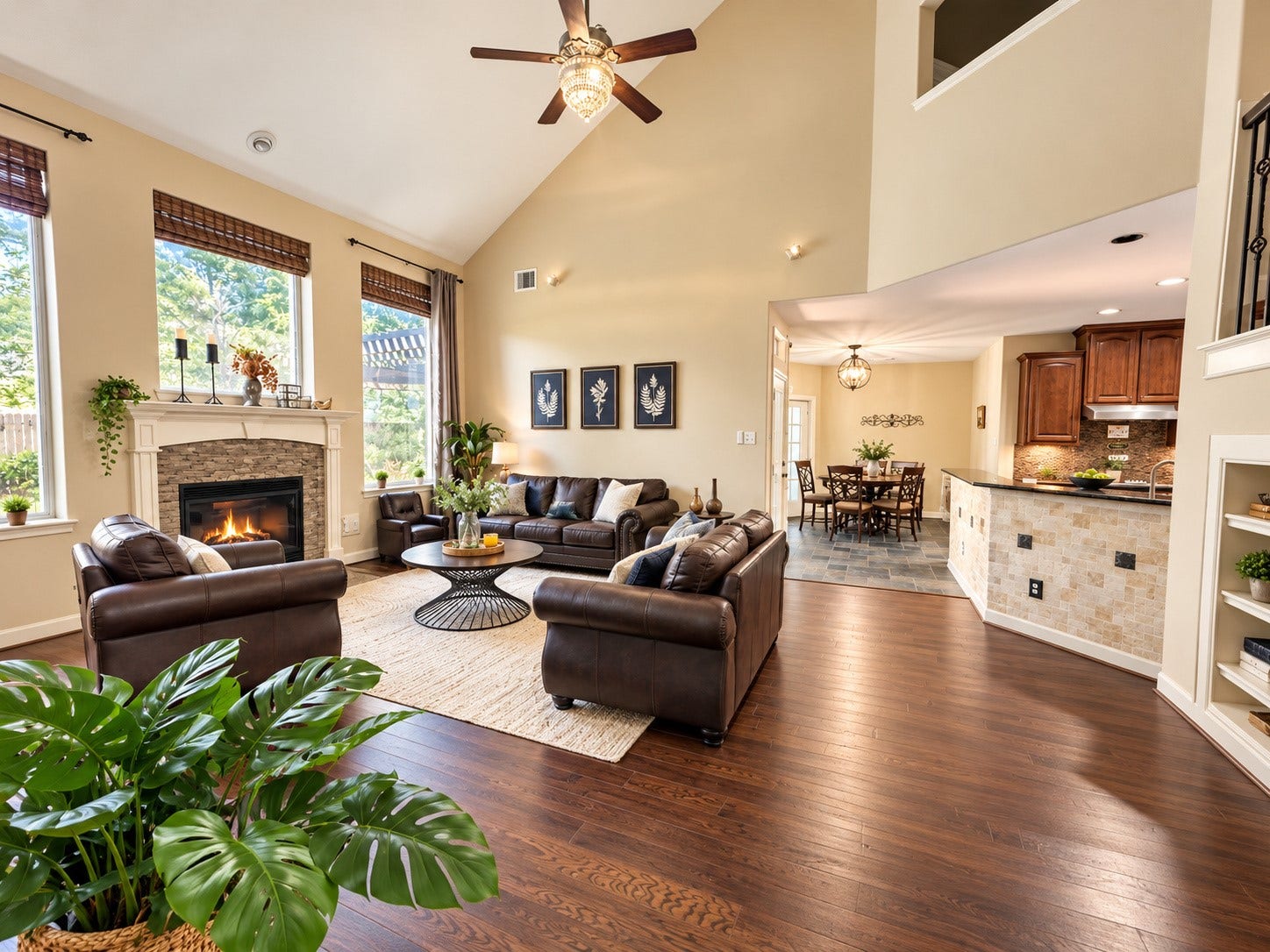 14215 Windy Crossing Lane, Humble, TX 77396 Dramatic family room with soaring ceilings, rich wood flooring, and a beautiful fireplace.
