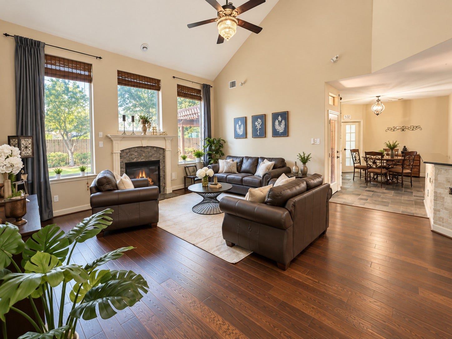 14215 Windy Crossing Lane, Humble, TX 77396 Dramatic family room with soaring ceilings, rich wood flooring, and a beautiful fireplace.