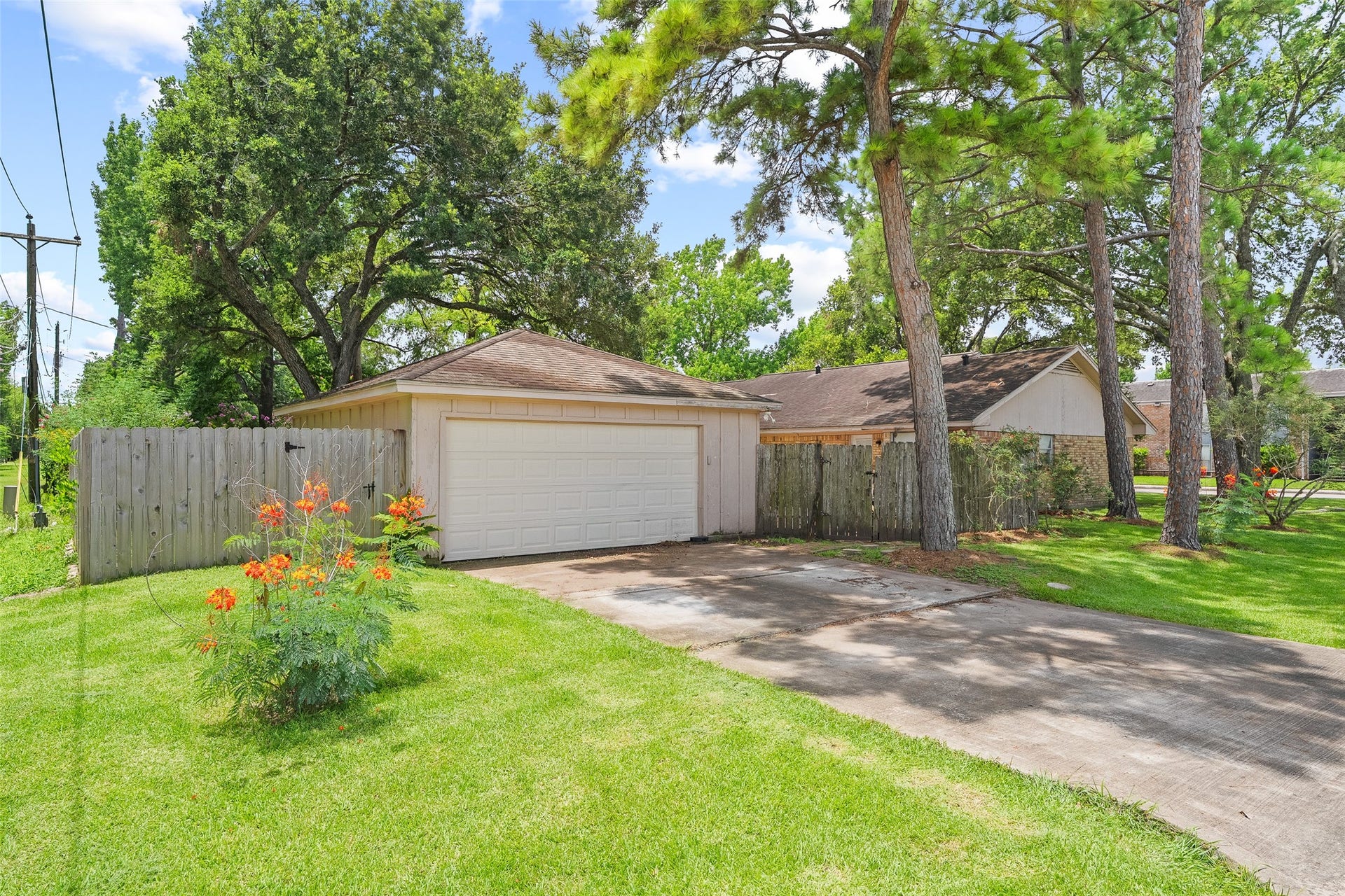 2001 Lamar Drive, Richmond, TX 77469 The detached two-car garage offers versatile space for parking, storage, or a workshop, making it a valuable extension of the home.