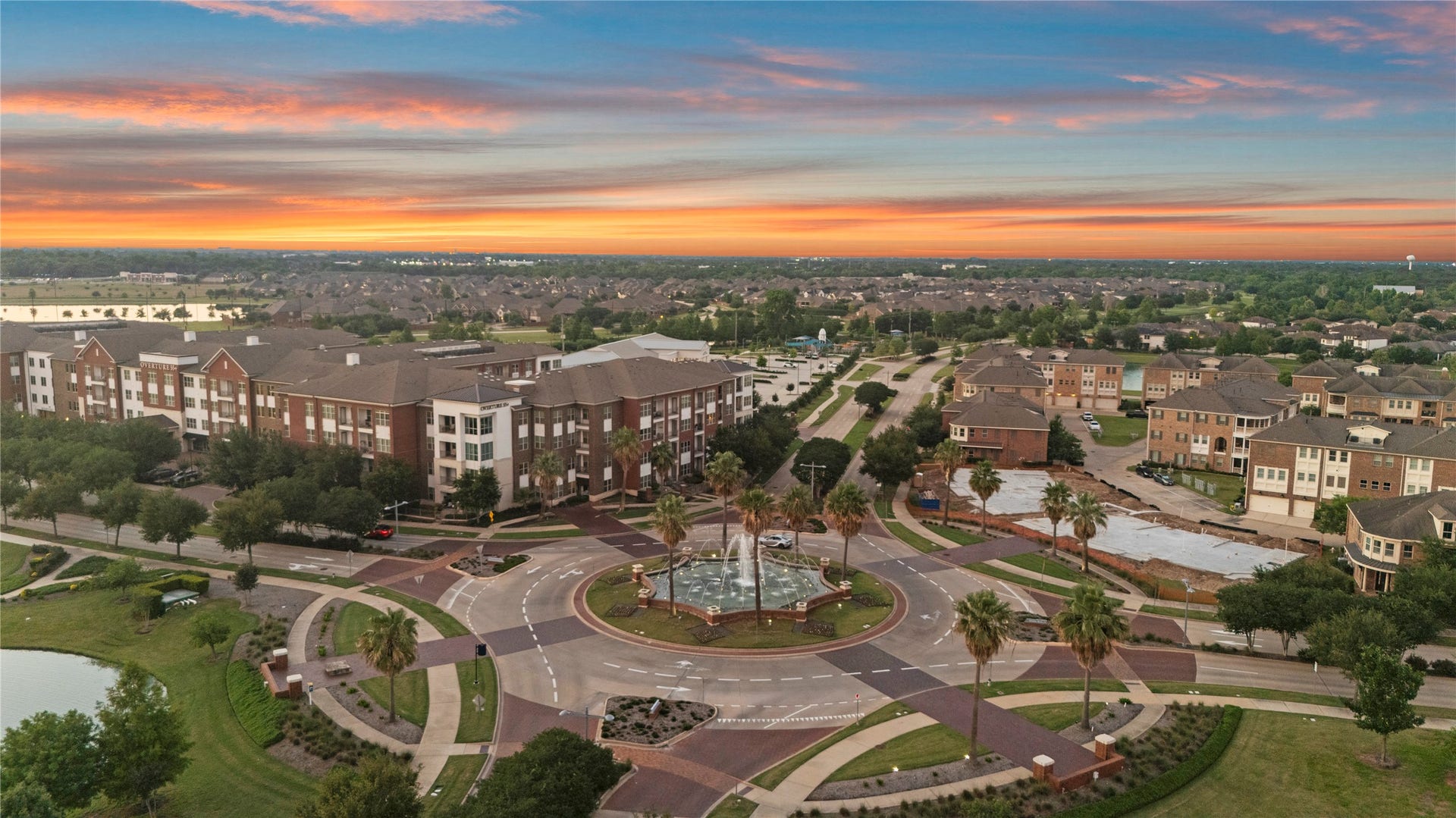 11 Victorian Run, Sugar Land, TX 77498 Cotton-candy skies glow above a palm-lined roundabout, where sparkling fountains and peaceful streets create the perfect sunset escape near by the Skeeters Stadium.