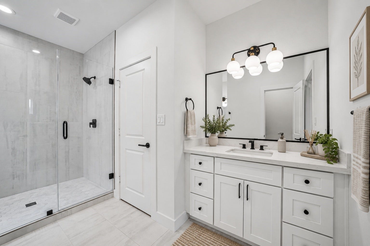 6415 Goforth Street, Houston, TX 77021 Primary Bath. Separate vanities and walk in shower with floor to ceiling tile surround.