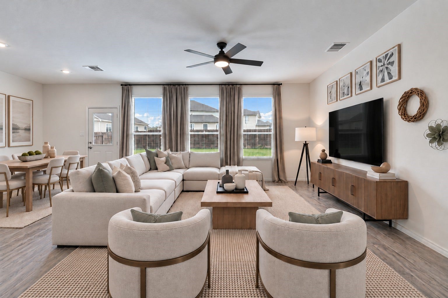 14424 Sunny Bend Way, Conroe, TX 77303 Virtually Staged: A modern ceiling fan with integrated lighting provides added comfort, while the high ceilings contribute to the room's airy, expansive feel.