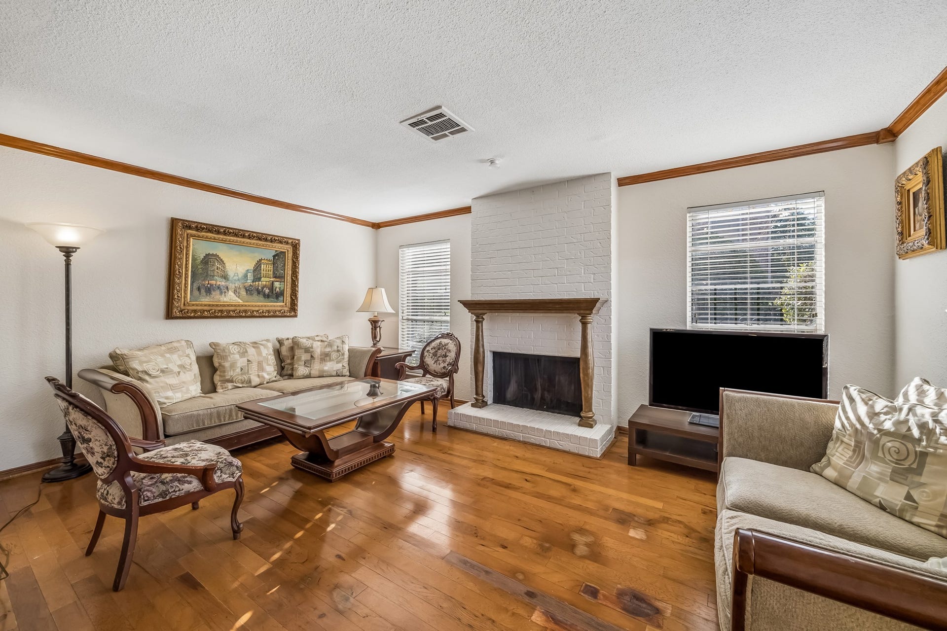 2515 Bering Drive, #1, Houston, TX 77057 Living room is light and bright with lots of windows and fireplace