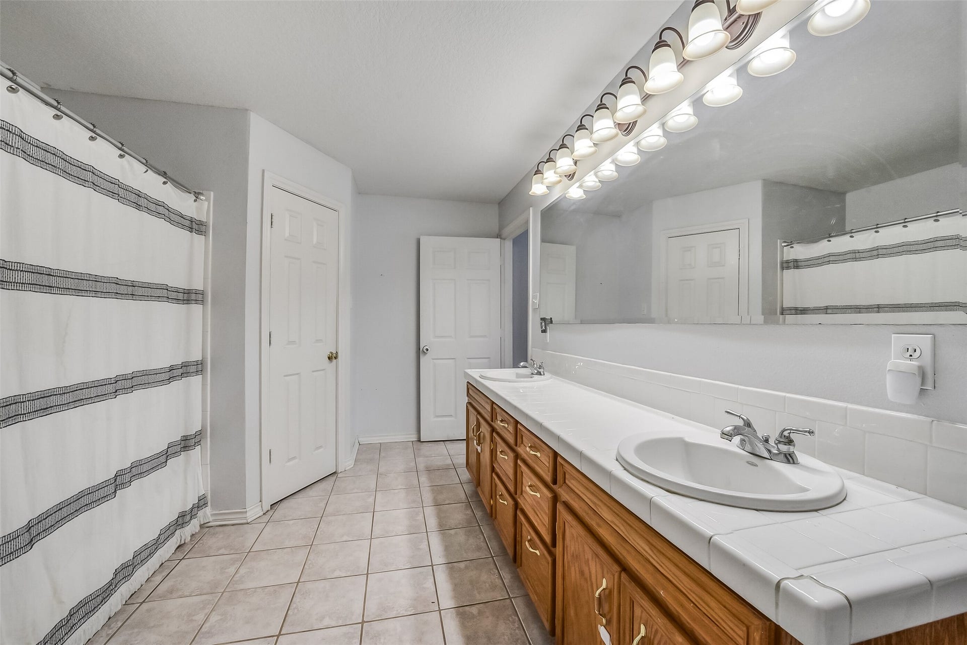 22911 Keith Drive, New Caney, TX 77357 Tile flooring in bathroom.