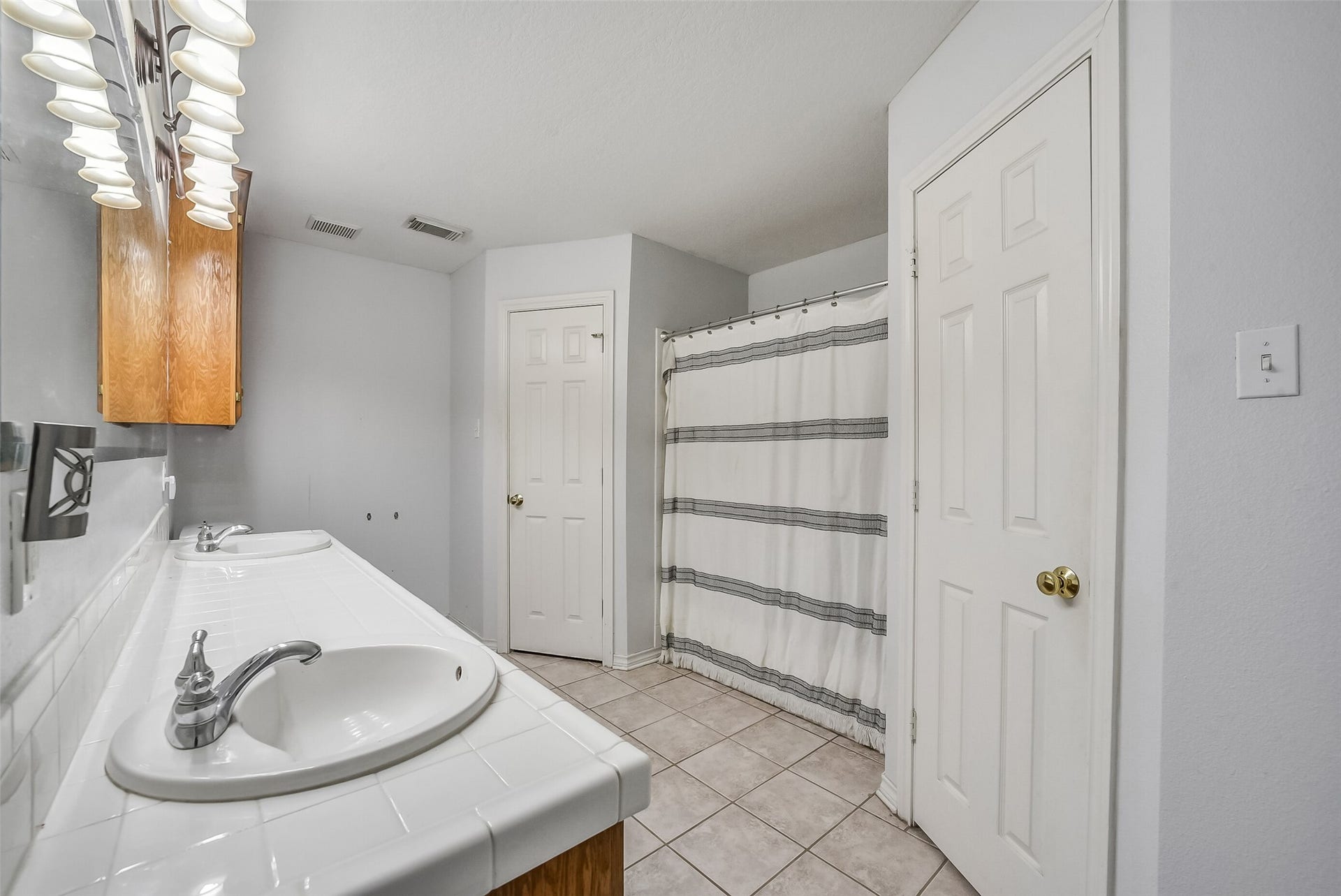 22911 Keith Drive, New Caney, TX 77357 Primary bathroom with his and her sink.