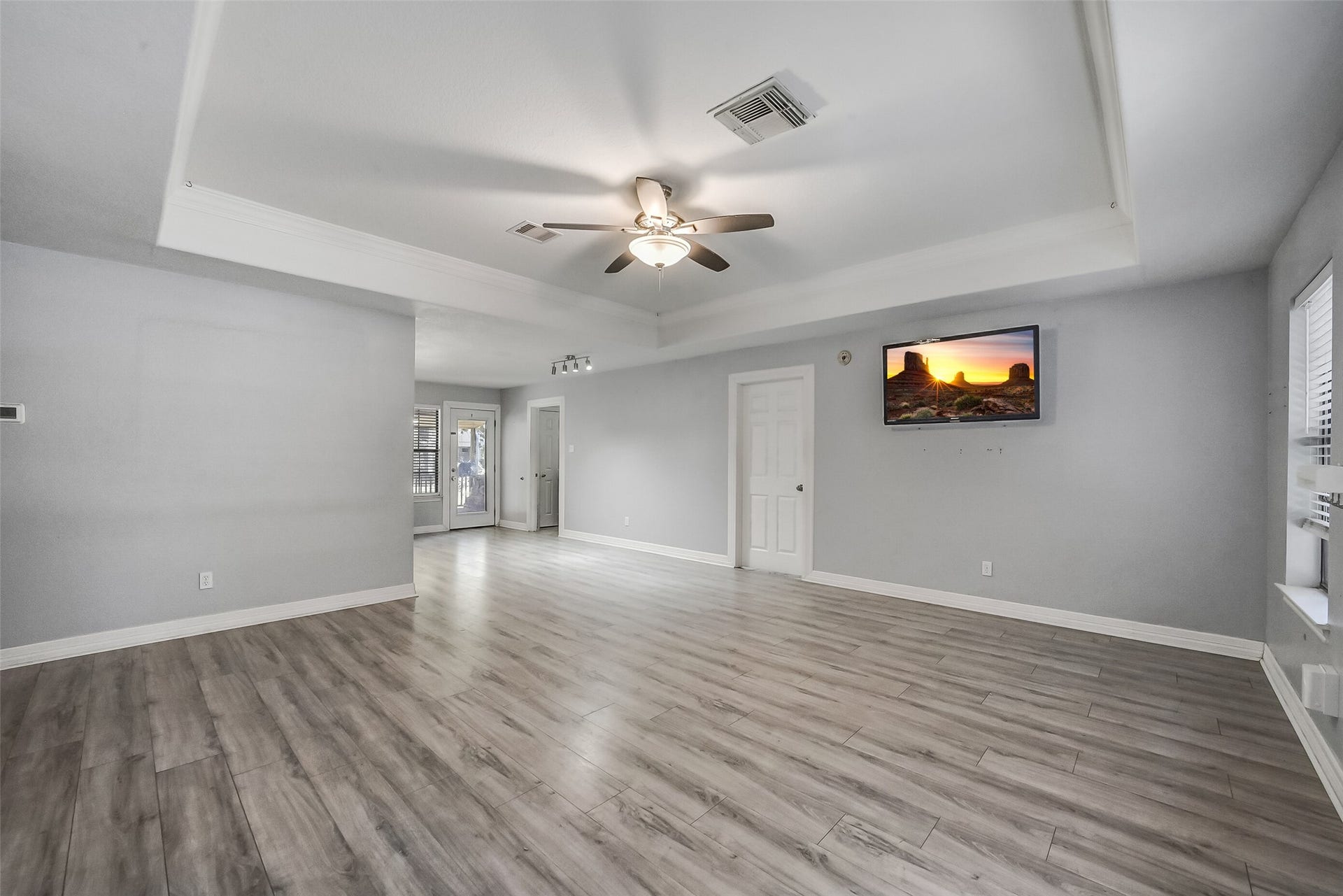 22911 Keith Drive, New Caney, TX 77357 Neutral tones and wood-look flooring create a warm, cohesive setting, while the spacious layout offers a comfortable gathering space for everyday living and entertaining.