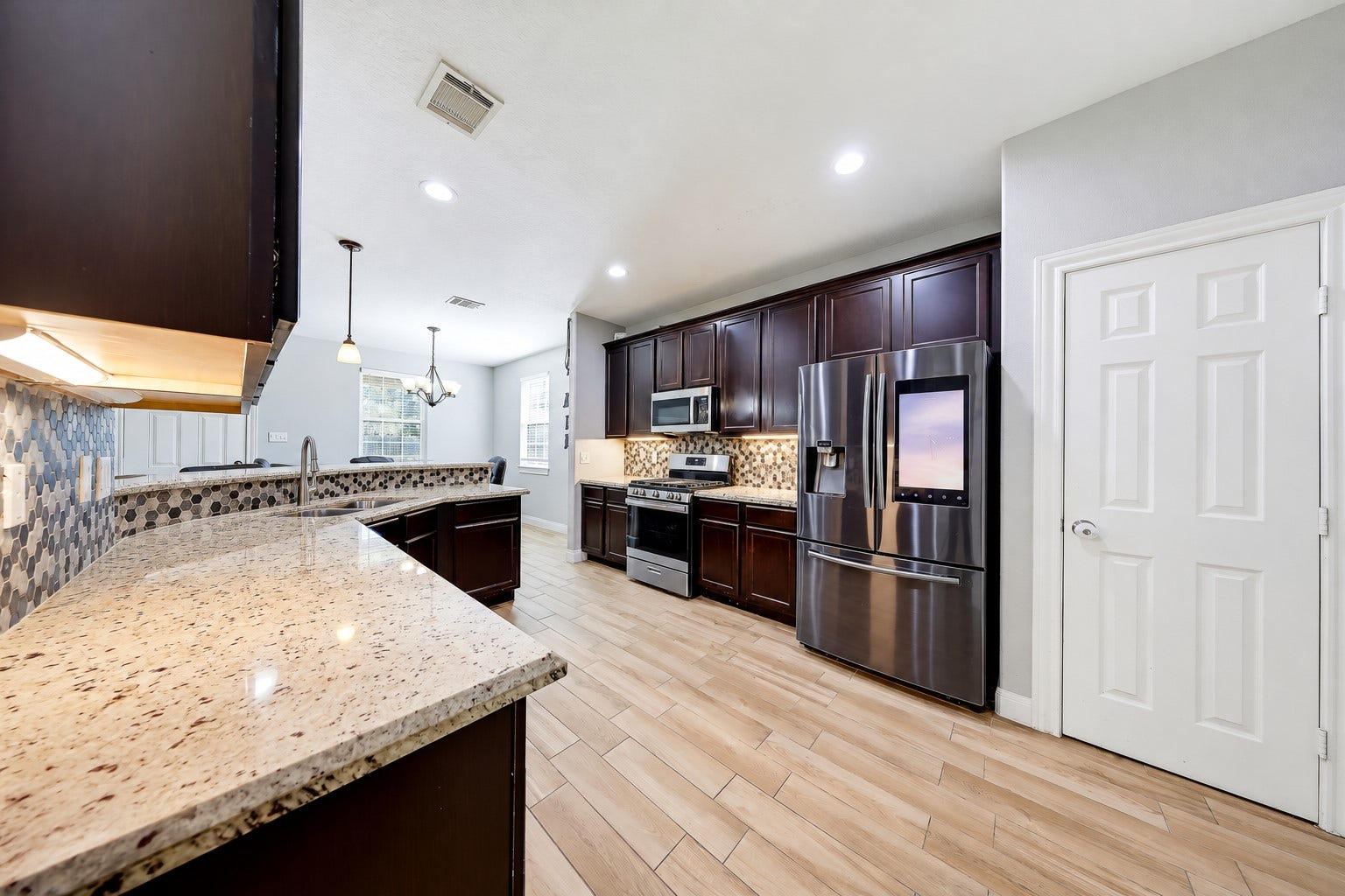 267 Freeman Boulevard, West Columbia, TX 77486 Granite counters and rich wood cabinetry give you a beautiful backdrop for everyday meals.