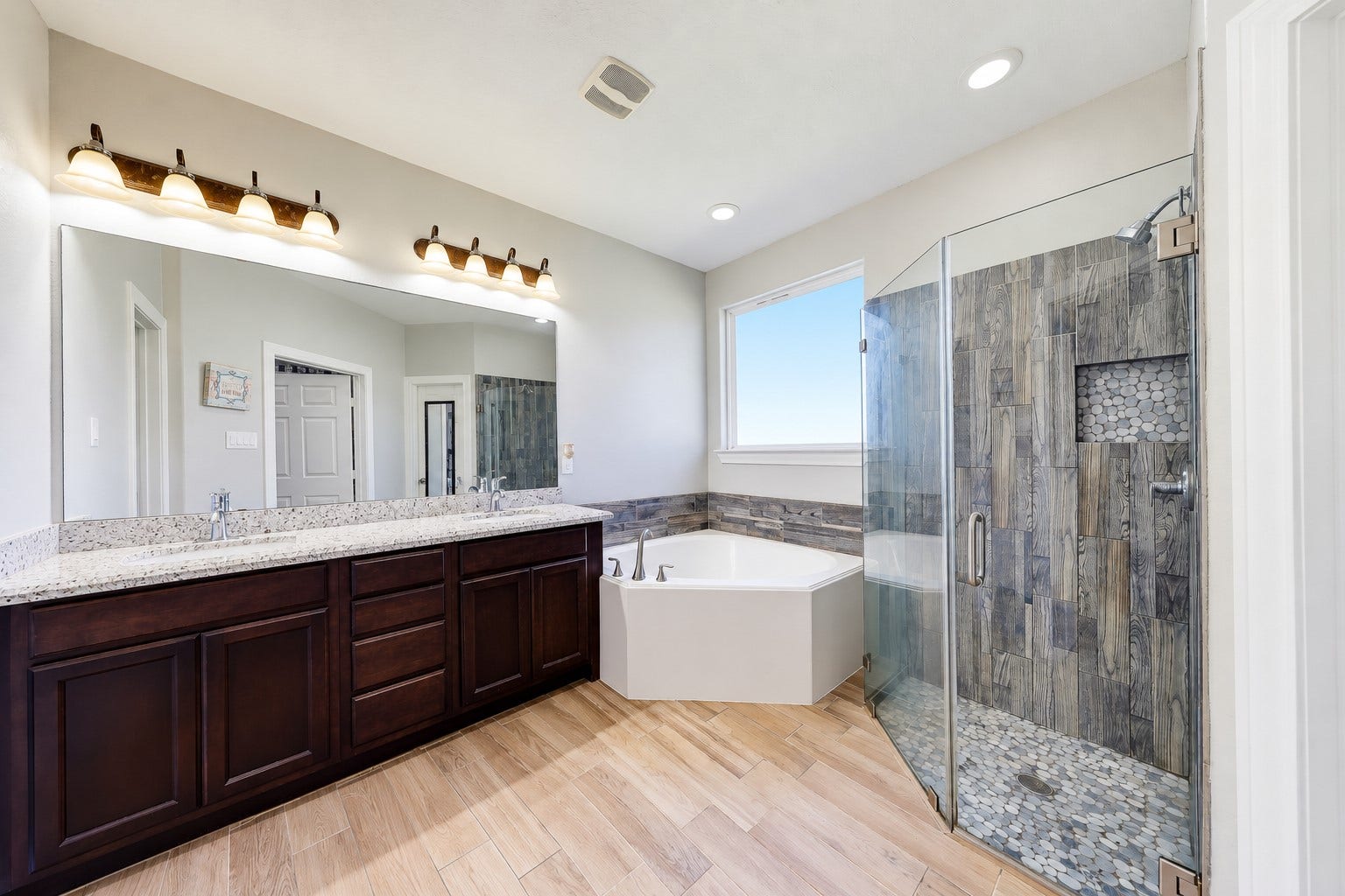 267 Freeman Boulevard, West Columbia, TX 77486 Recharge your way with double sinks, a soaking tub, and a separate glass-enclosed shower.