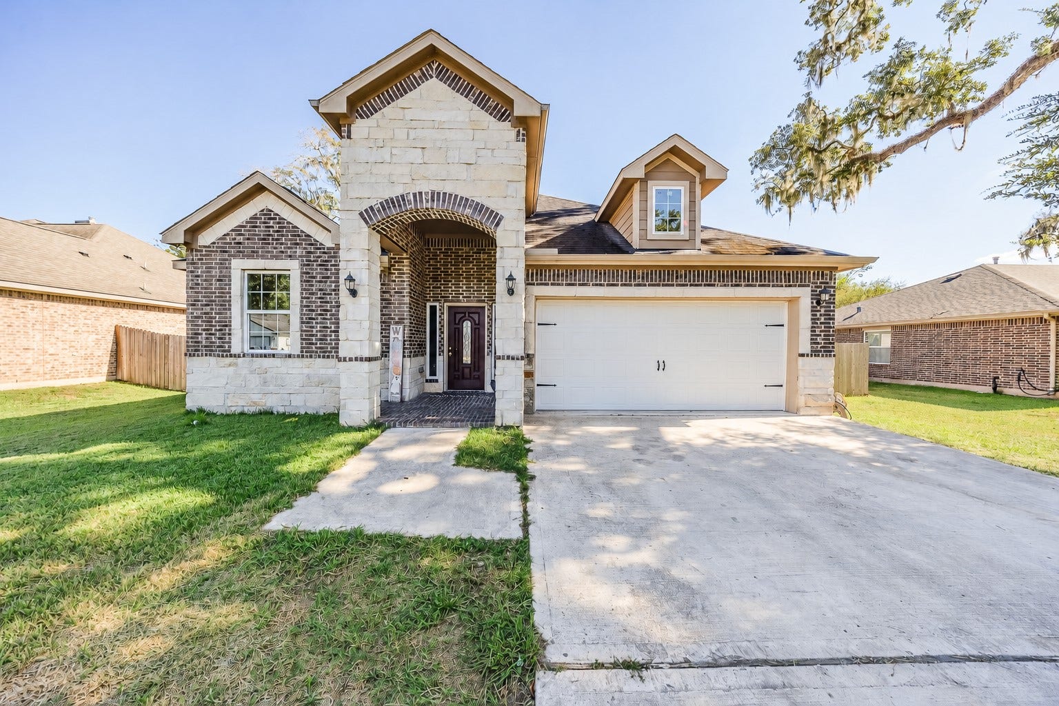 267 Freeman Boulevard, West Columbia, TX 77486 A grand brick-and-stone entrance makes every arrival feel special.
