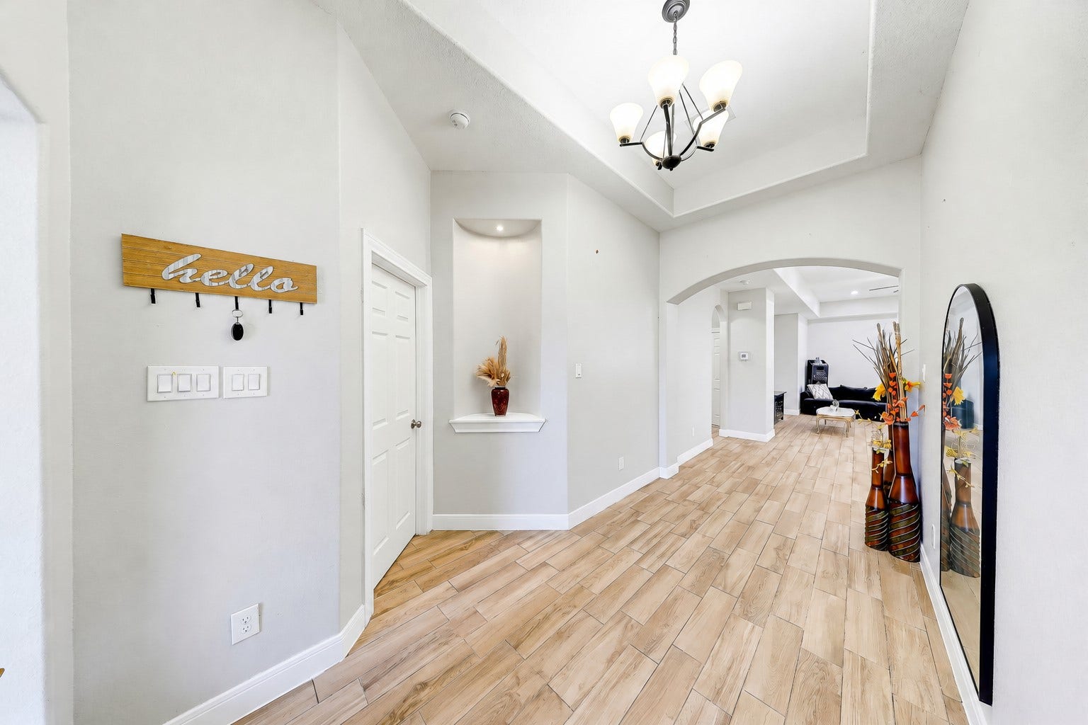267 Freeman Boulevard, West Columbia, TX 77486 Welcome guests through a lofty foyer with graceful arches and wood-look tile.