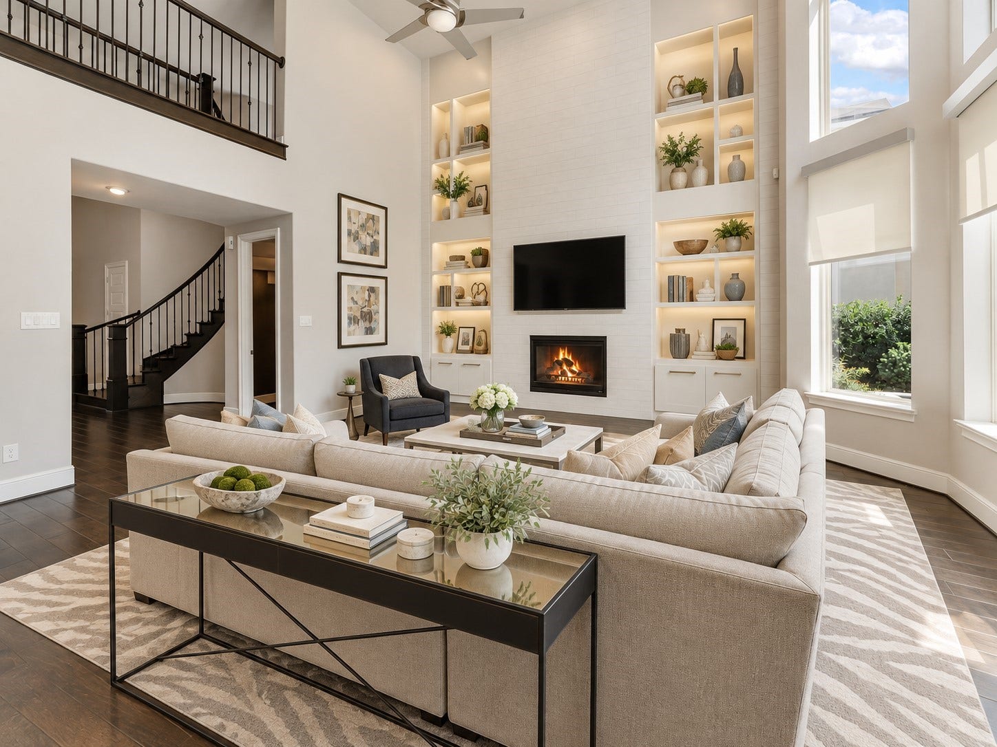 Expansive family room with custom built-ins, abundant natural light, and open-concept flow. (Virtually staged)