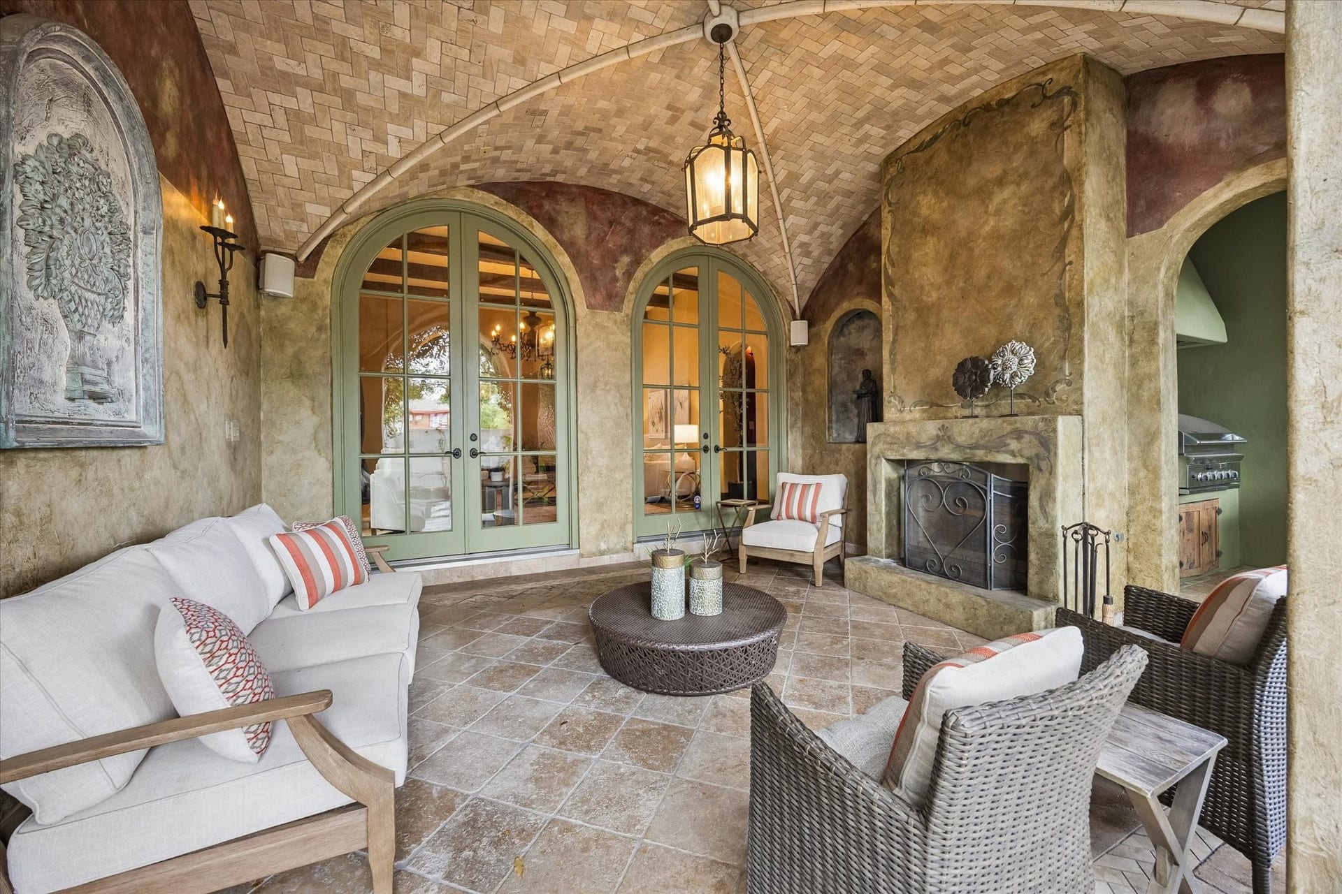 5120 Mt Vernon, Houston, TX 77006 Conveniently accessed via the living room, this charming outdoor space has a groin tiled ceiling, working fireplace and adjacent outdoor grill.