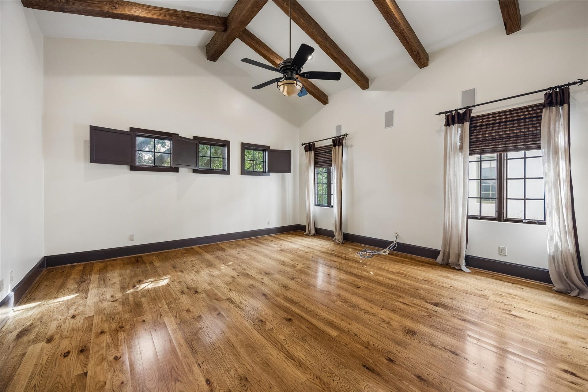 5120 Mt Vernon, Houston, TX 77006 The primary bedroom features a beamed ceiling, pecan hardwood floors and window coverings for ALL windows.