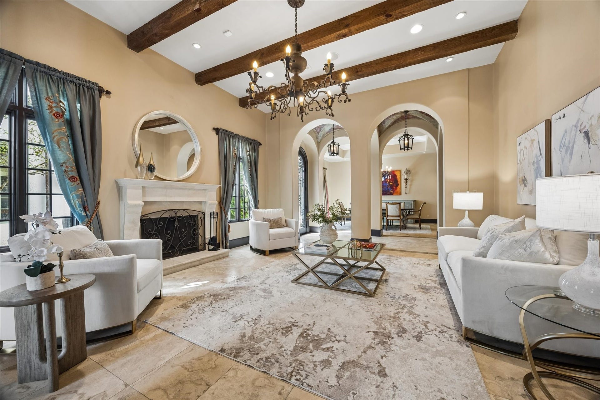 5120 Mt Vernon, Houston, TX 77006 Limestone floors, beamed ceilings, crushed granite fireplace surround are just a few of the living room details that make this home so interesting.