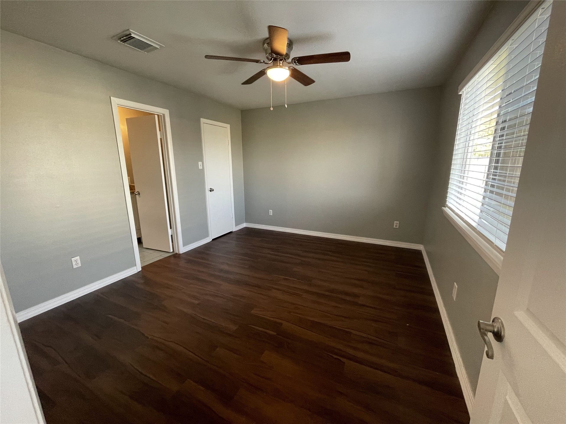 2915 Garden Lane, Sugar Land, TX 77479 Master bedroom with new fan light and wood blinds