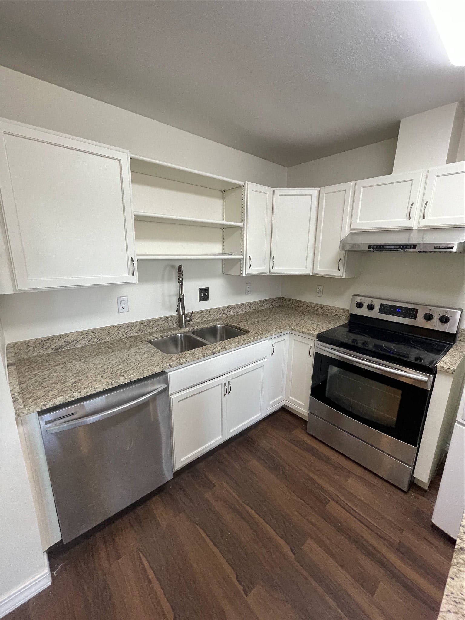 2915 Garden Lane, Sugar Land, TX 77479 Renovated kitchen with granite countertops and stainless steel appliances
