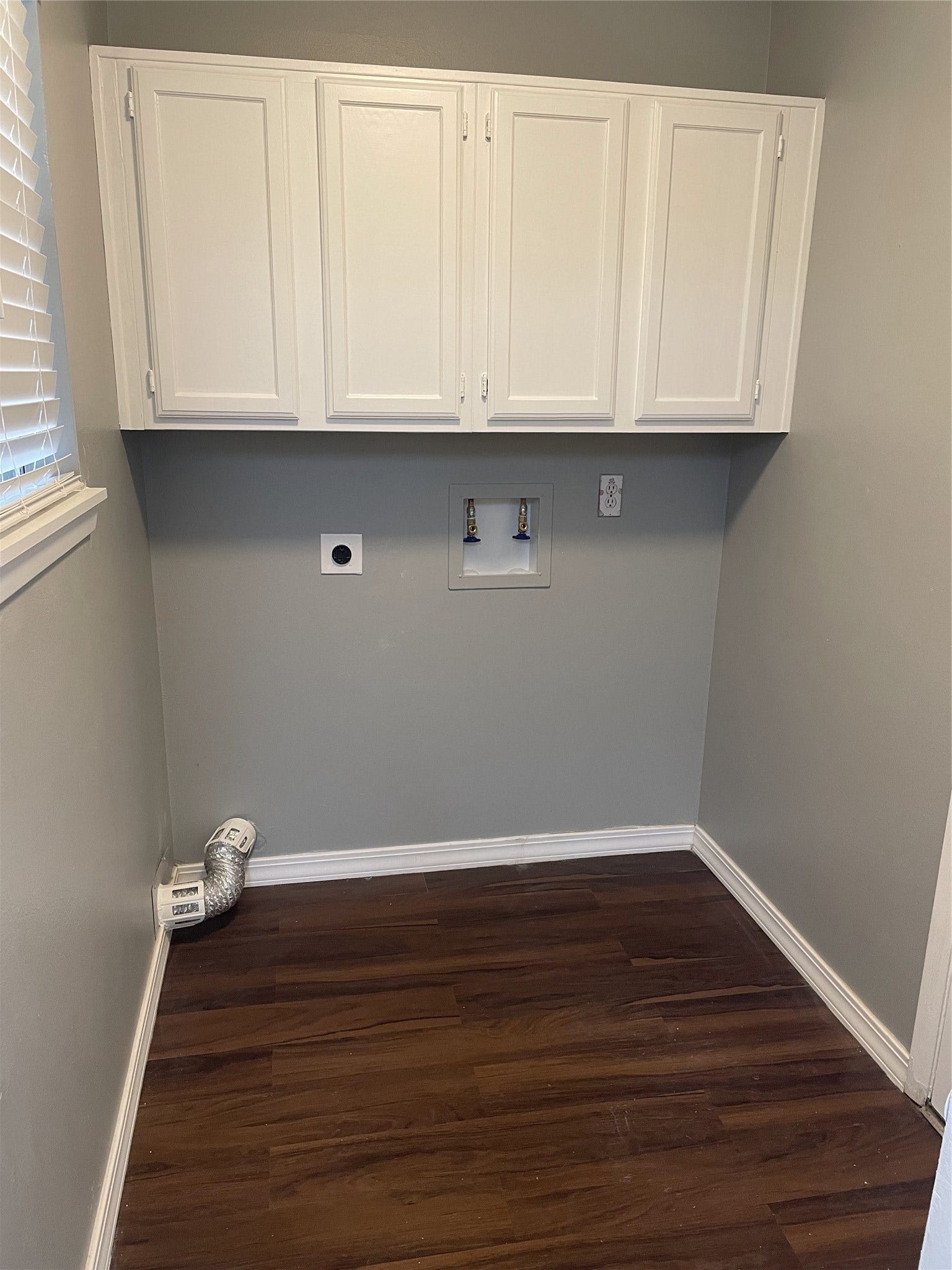 2915 Garden Lane, Sugar Land, TX 77479 Laundry room with built-in storage cabinets