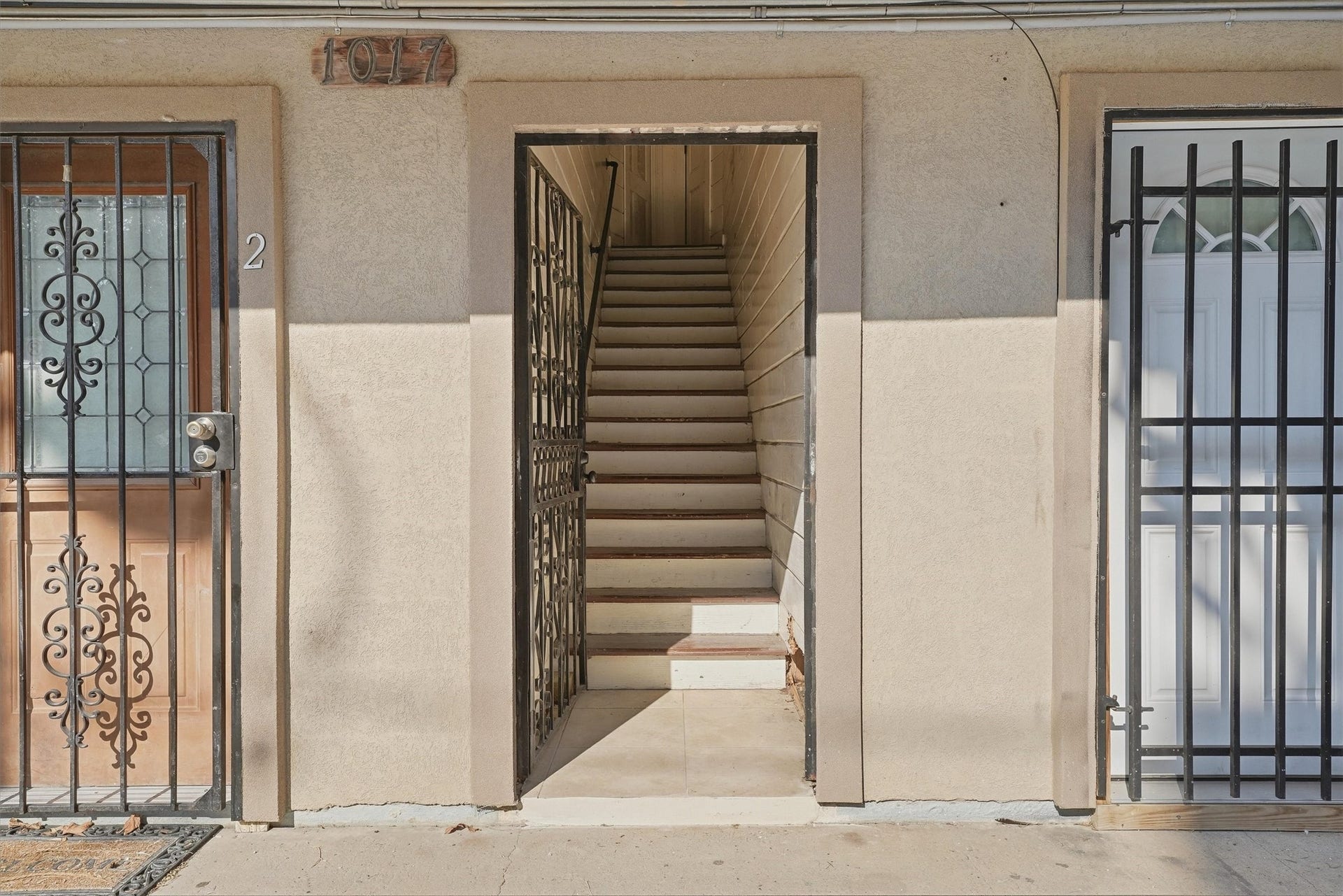 1017 Court Street, Houston, TX 77007 Stairs lead to two upstairs units, both which are two bedrooms, one bath.