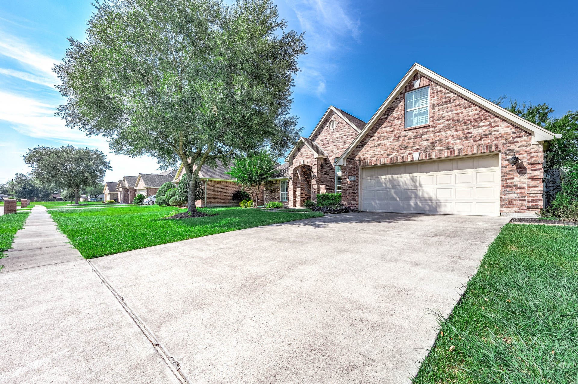 Spacious double driveway and two-car garage provide ample parking for all your needs.