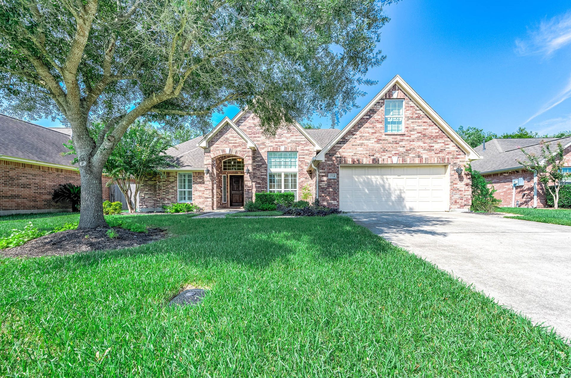 Discover the charm of 1714 Prince Dr., where a stunning brick exterior and lush landscaping welcome you to your dream home.