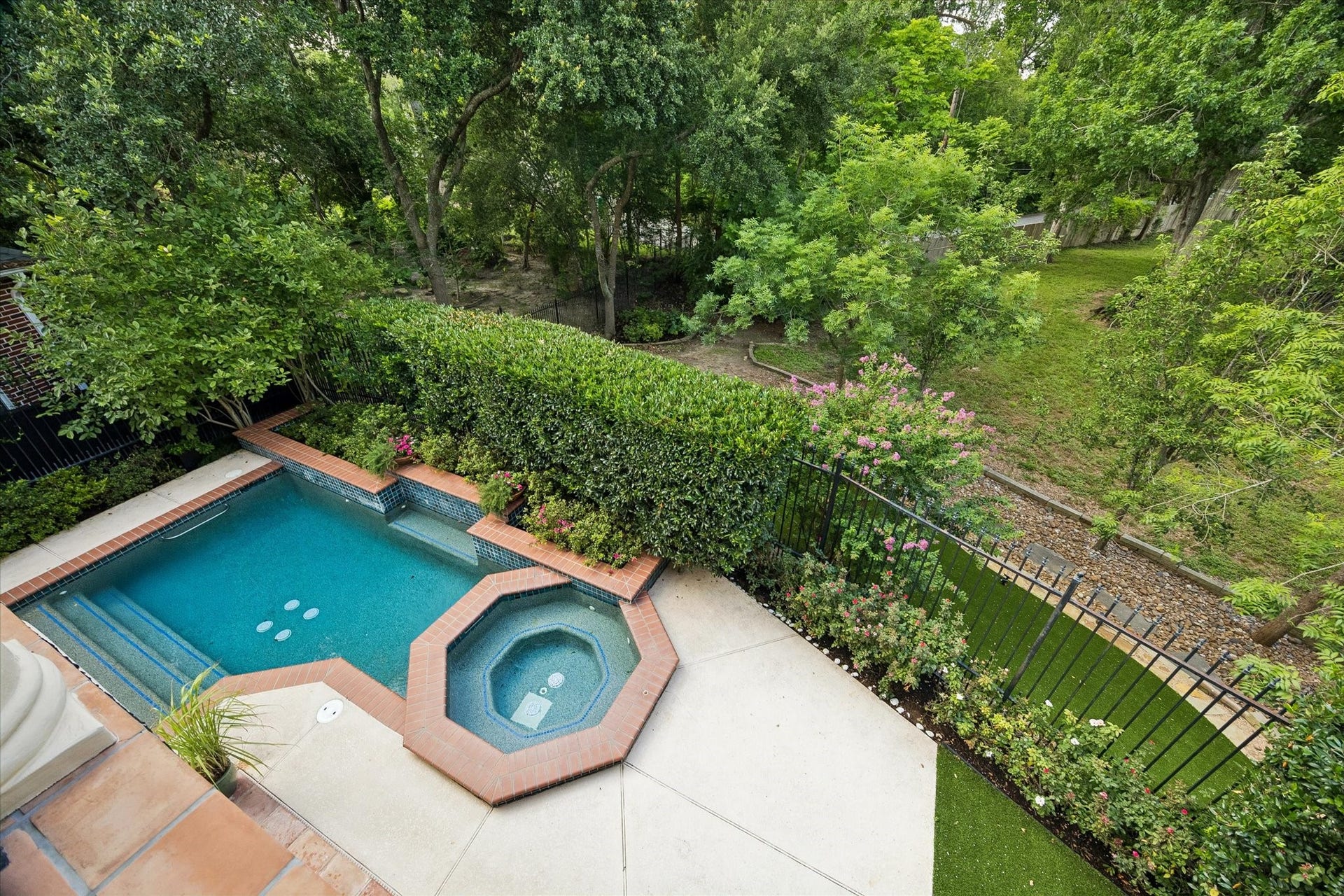 View to the pool from the second floor shows the lush ravine setting.