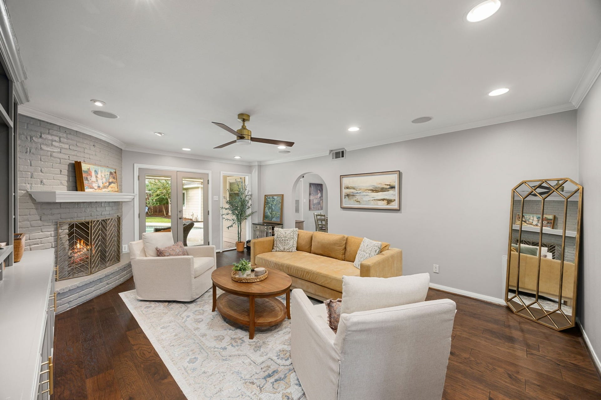 10831 Britoak Lane, Houston, TX 77079 The living room has French door leading to the patio and connects to the kitchen.