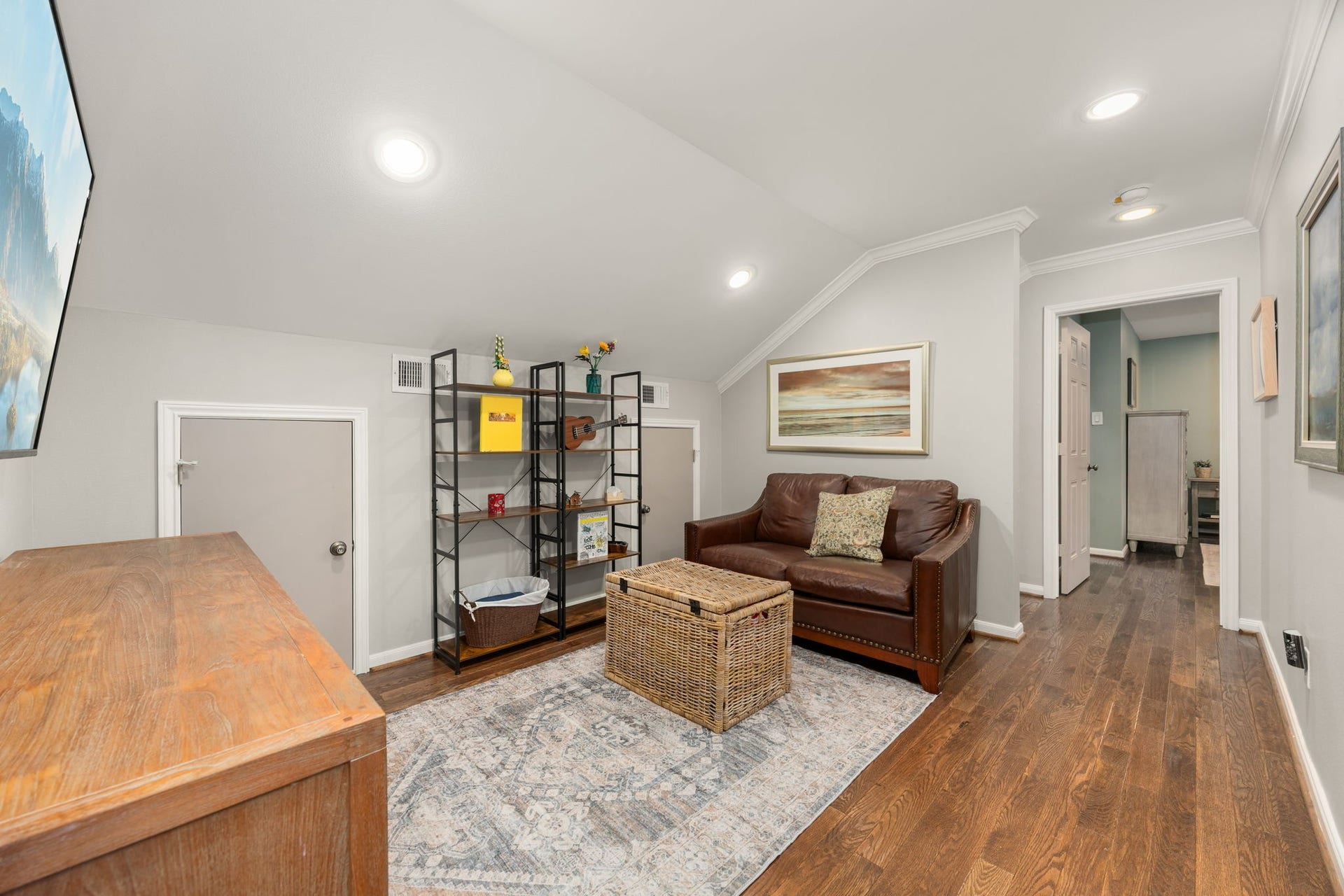 10831 Britoak Lane, Houston, TX 77079 Upstairs TV room, the second floor primary is on the right.
