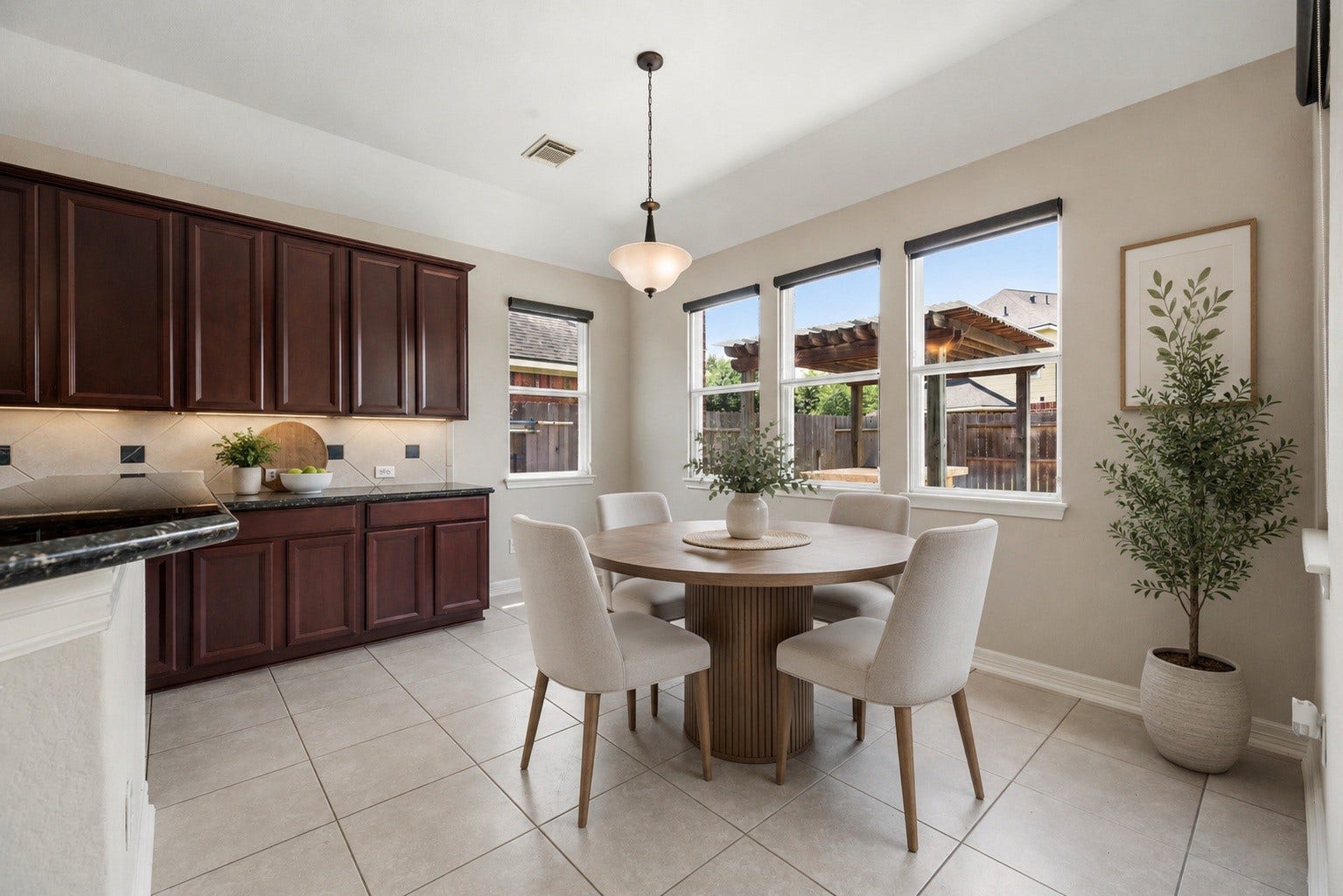 3707 Cat Springs Lane, Missouri City, TX 77459 Nestled next to the kitchen, the breakfast area offers a charming space for casual meals with large windows that flood the room with natural light. Virtually staged.