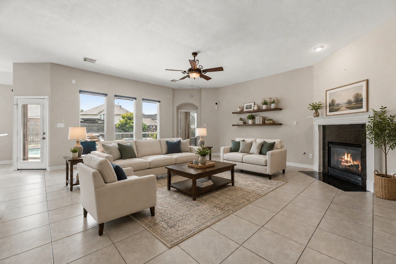 3707 Cat Springs Lane, Missouri City, TX 77459 The heart of the home features a majestic gas log fireplace and a wall of windows that offer serene views of the private pool. Virtually staged so you can imagine the possibilities.