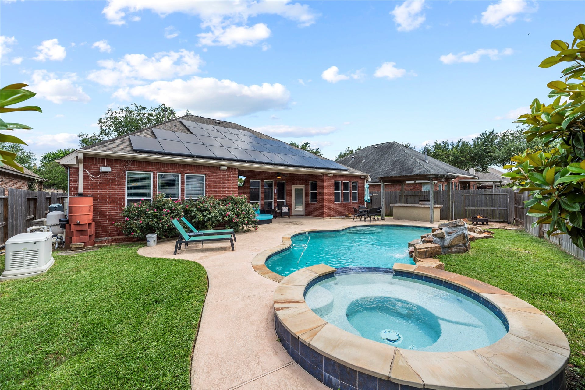 3707 Cat Springs Lane, Missouri City, TX 77459 Relax in the sun on the vast patio surrounding the sparkling pool, which also includes a heated spa for year-round enjoyment.