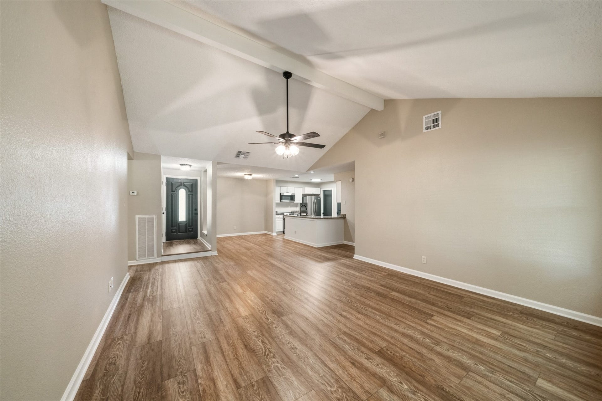 3200 Sand Reef Lane, League City, TX 77573 View of living room, dining area, and kitchen from the back door