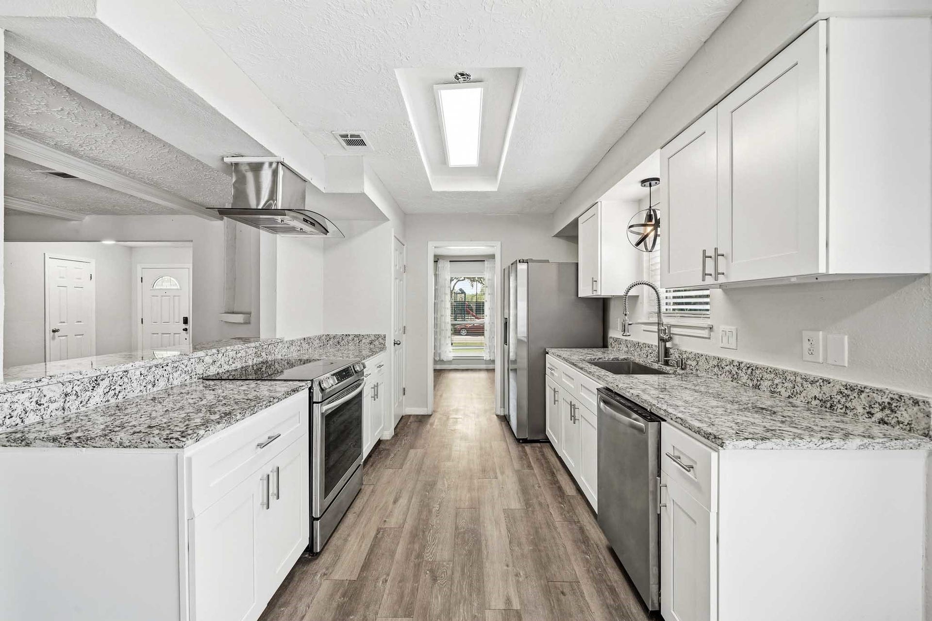 12010 Dorrance Lane, Meadows Place, TX 77477 This spacious kitchen is a dream with its granite counters and stainless aplliances.